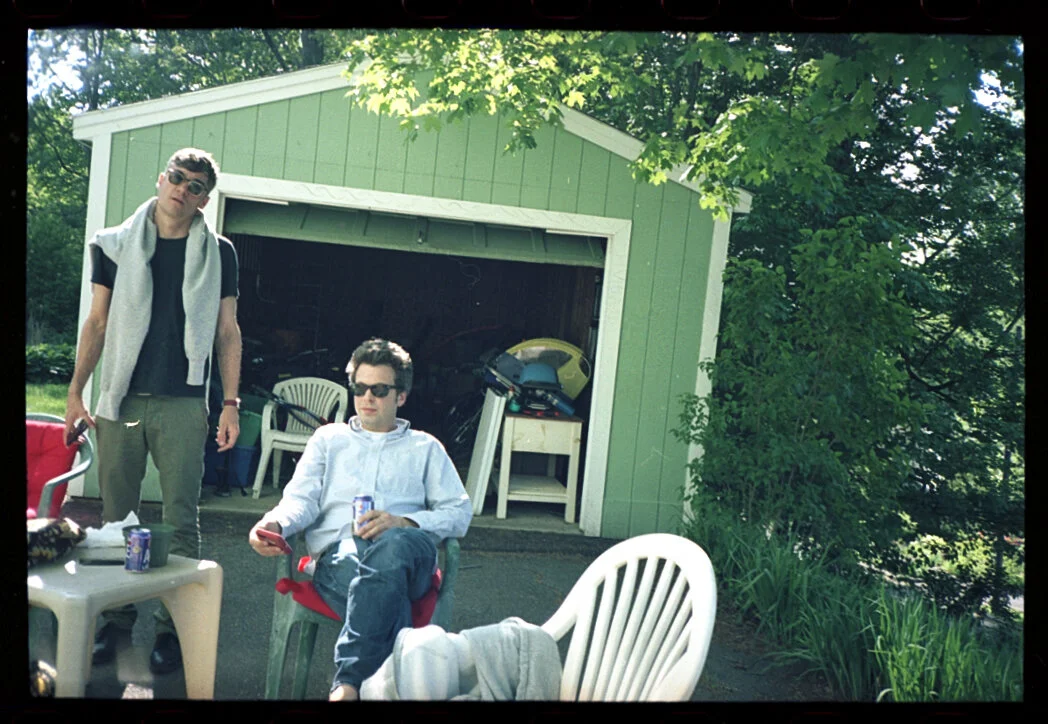 Film photograph of people relaxing in the back of a Northampton MA house