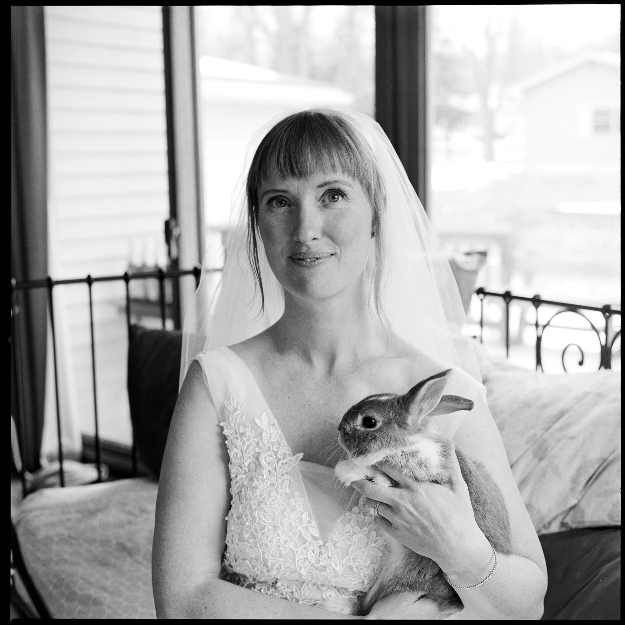 Bride holding a bunny taken with a Hasselblad