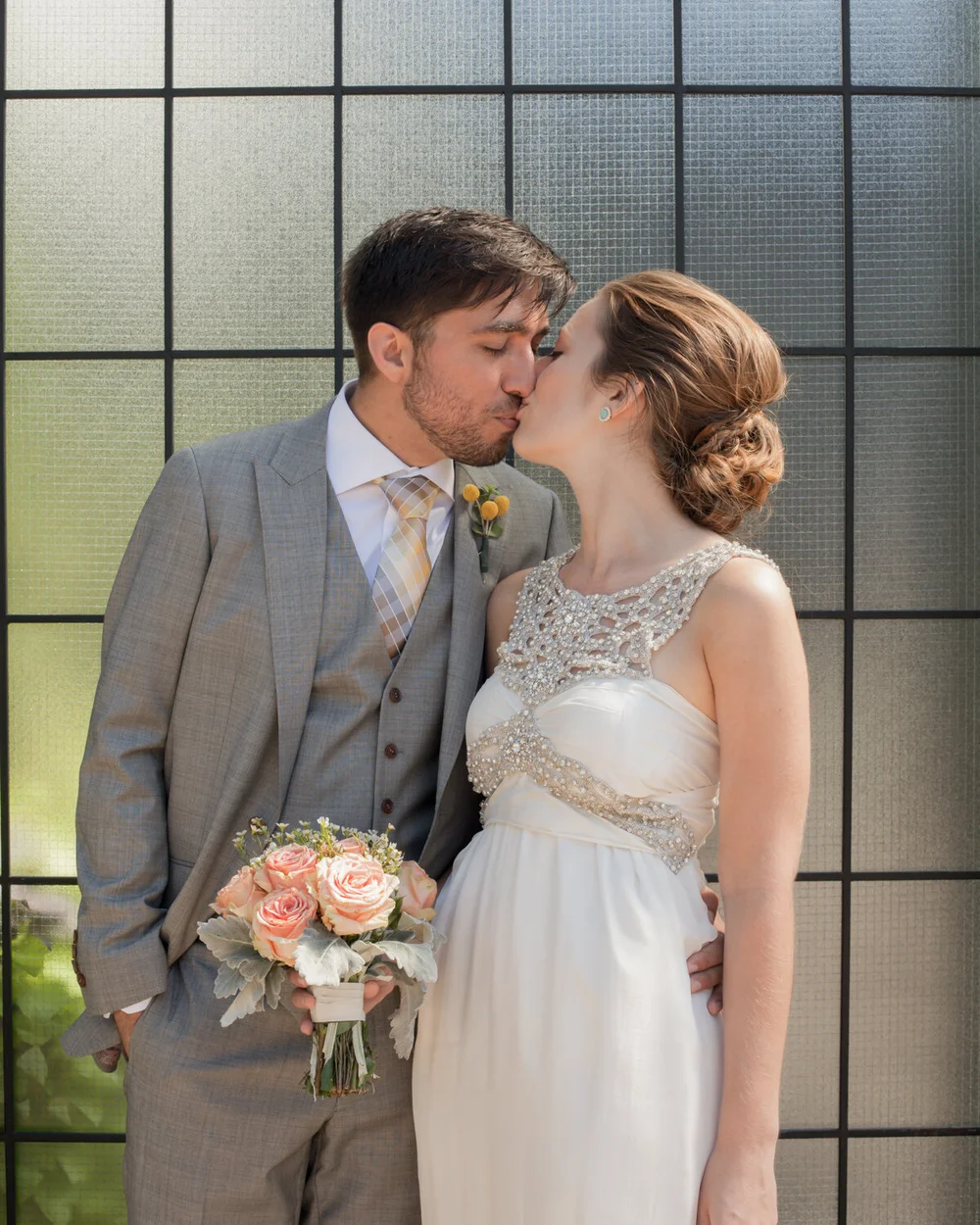  A chic wedding couple kisses, by a New York wedding photographer.     