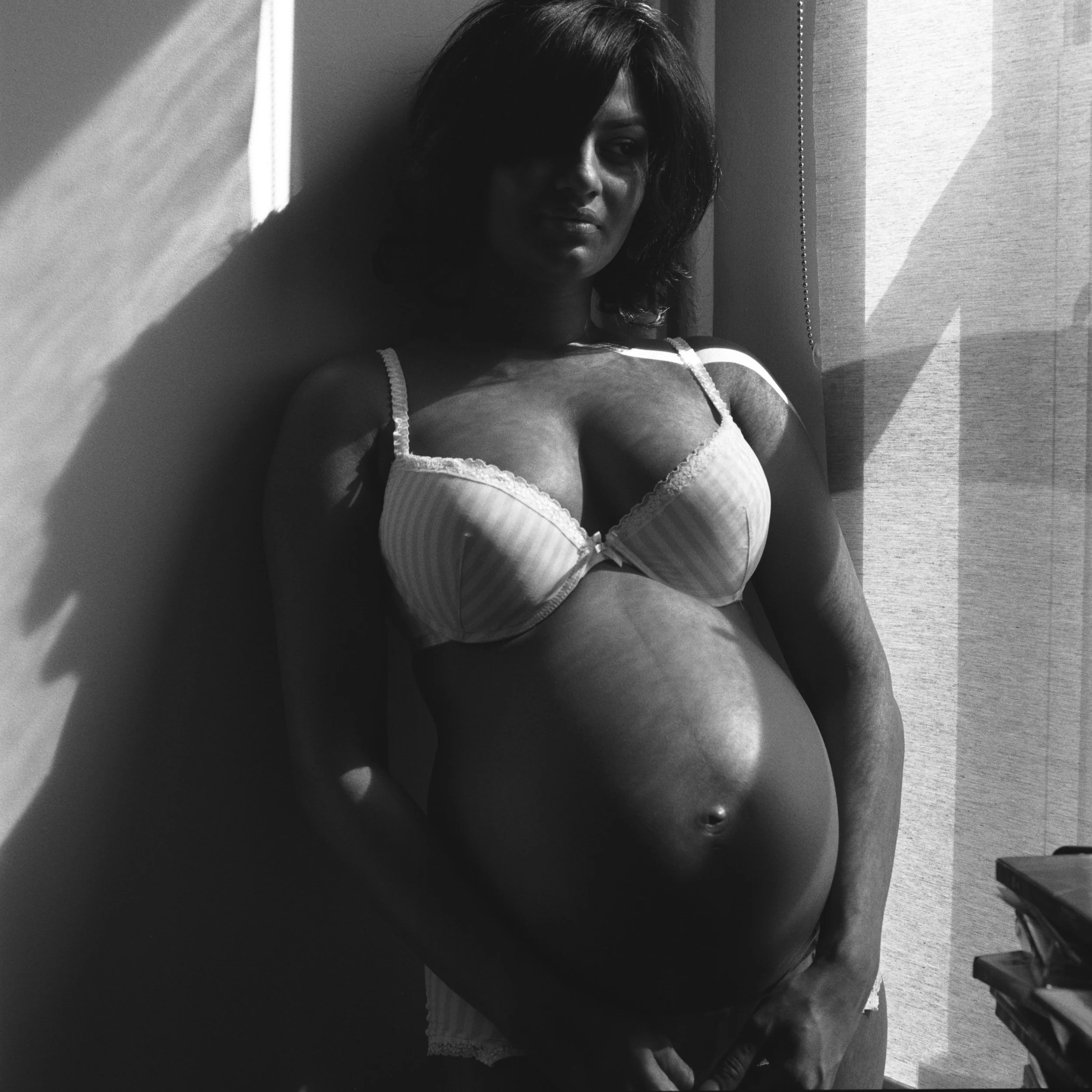  New York Maternity photographer woman in sunlight black and white 