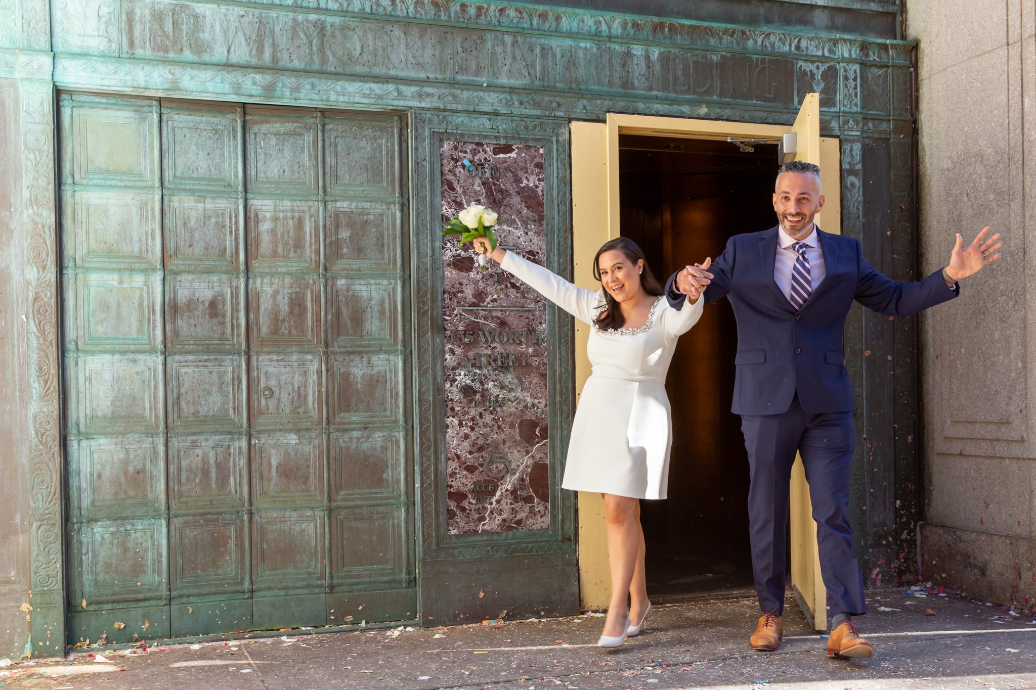 couple exits their nyc city hall wedding