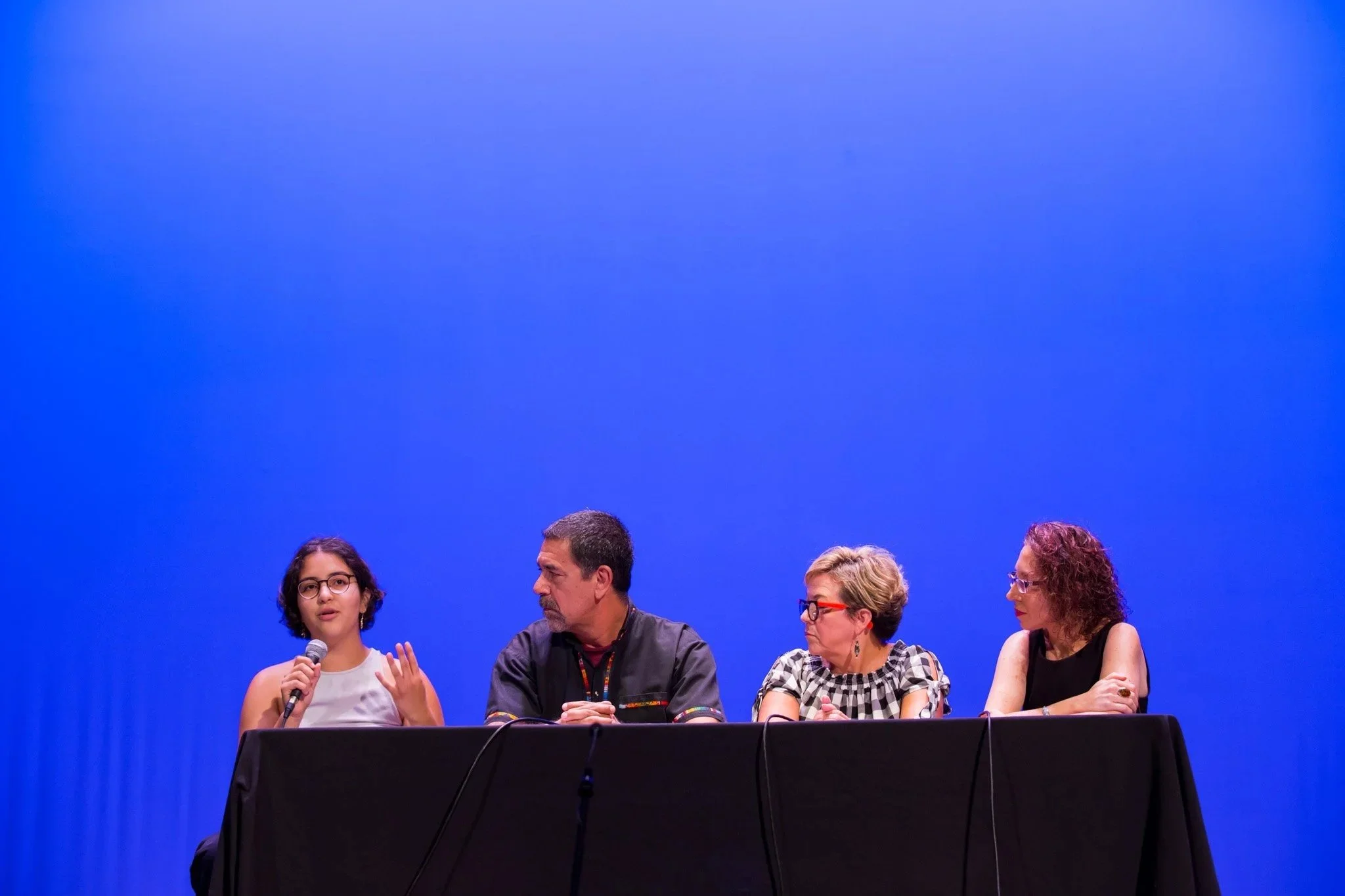  New York Corporate Event Photographer Elizabeth Solaka covers an NYC University Event, a panel discussion on a stage. 