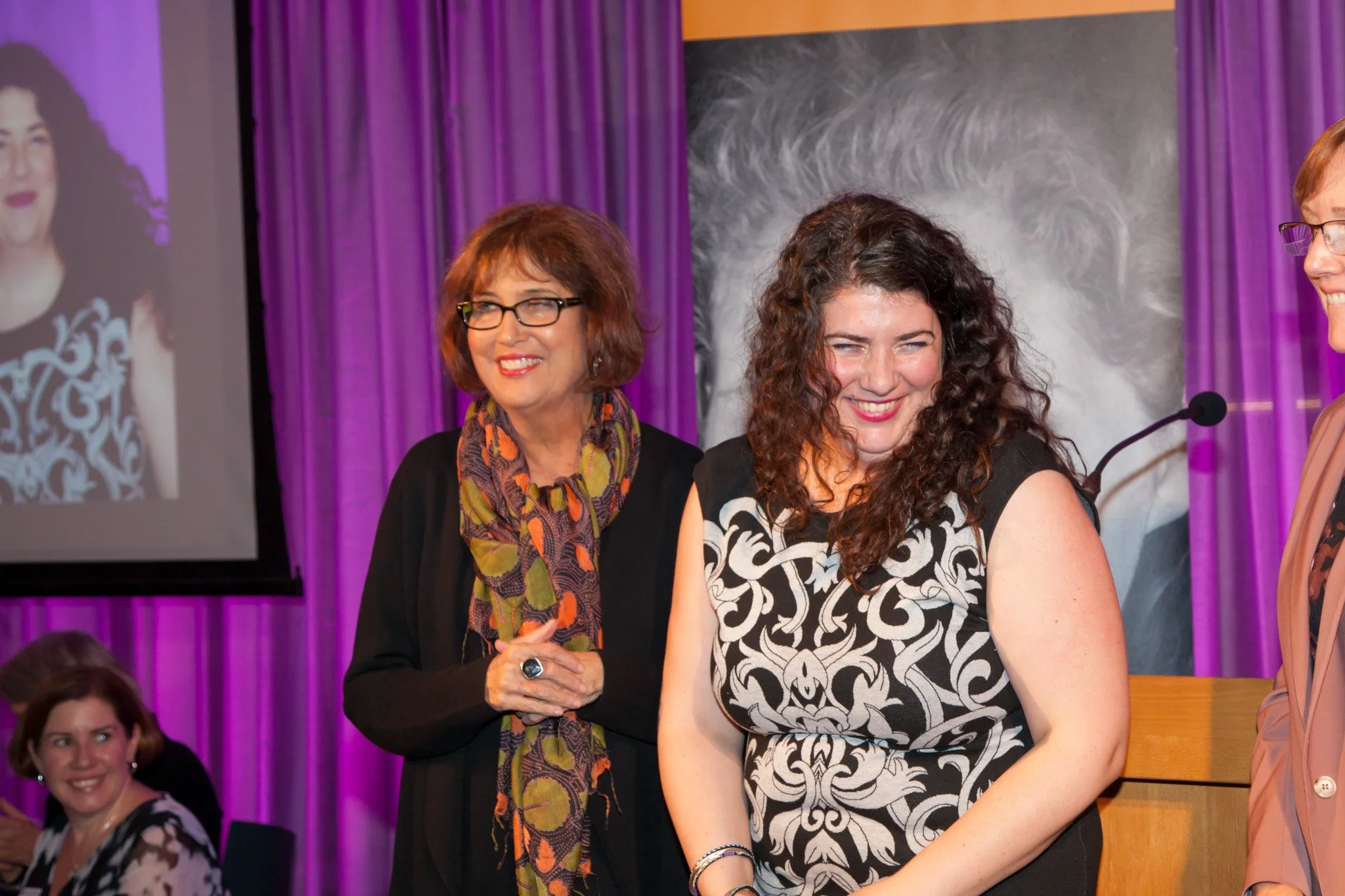  Speaker at a New York Corporate event smiles and NYC event photographer Elizabeth Solaka takes the picture. 