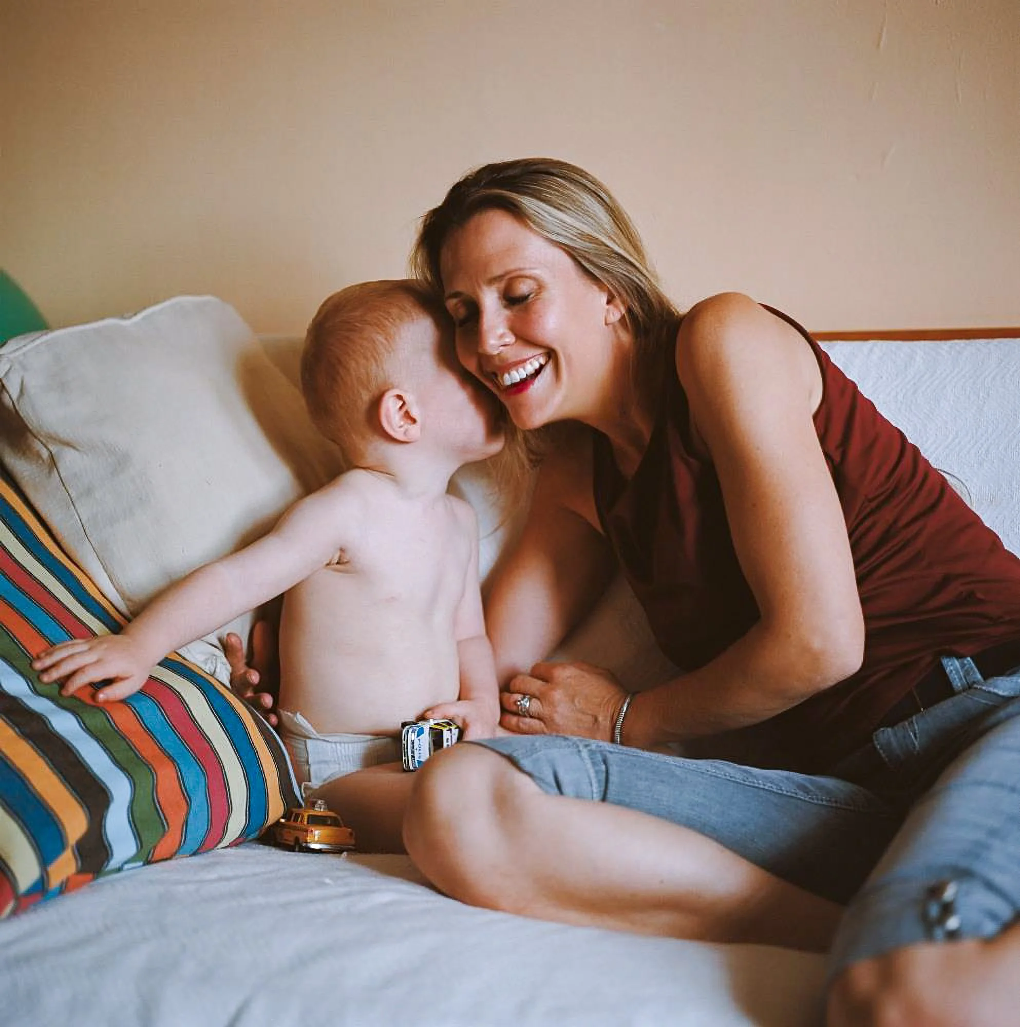 mom and infant son on a couch