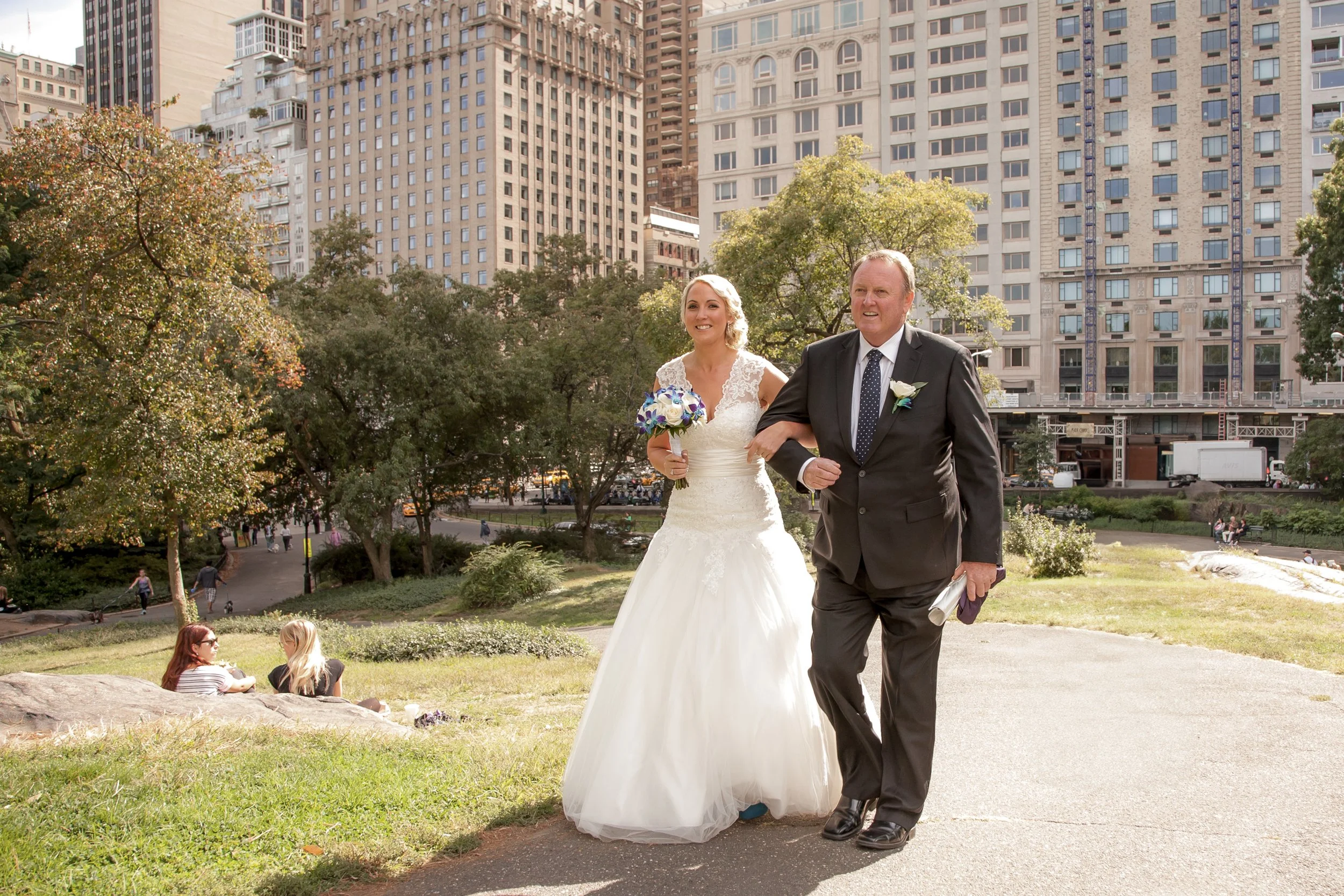 Bride and father smile at her Central Park wedding