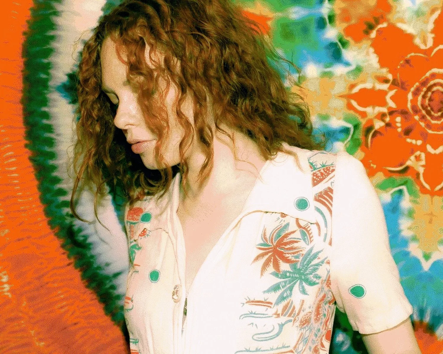 nyc fashion model poses in front of tie dye textile