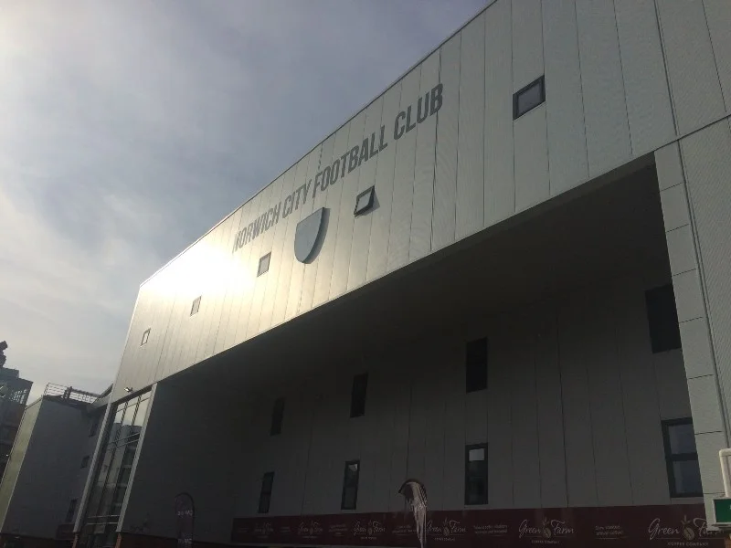 The South Stand edifice: even the club’s bright-yellow badge is rendered colourless.