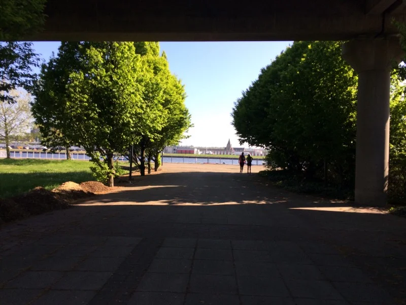 Through the shade of the DLR, the blue of the dock.