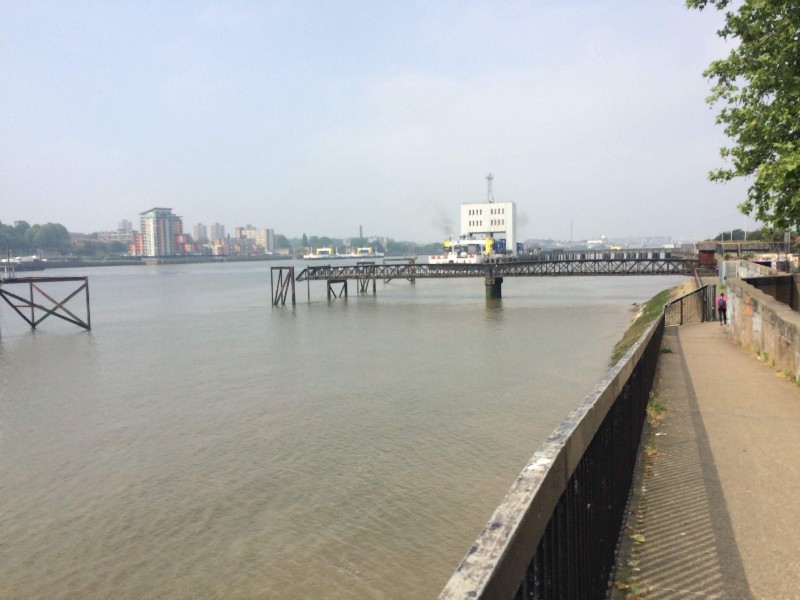 The modern ferry hides behind the iron Victorian pier.