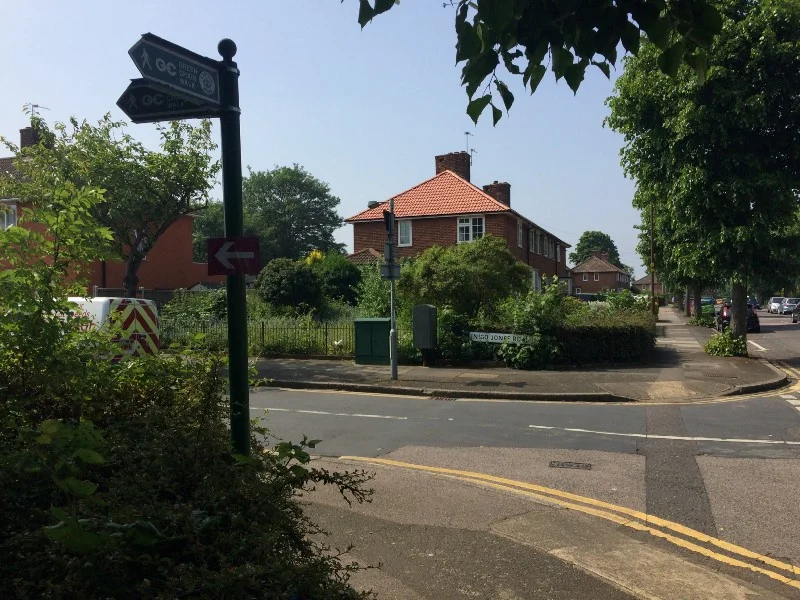 Inigo Jones Road. Note arrows, including the Green Chain Walk our path is largely following.