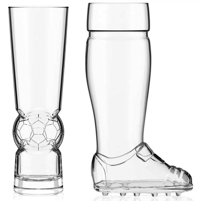 Two beer glasses side by side. One is a tumbler that incorporates a soccer ball. The other is similar to the iconic beer boot, but it's a leg with a soccer cleat.