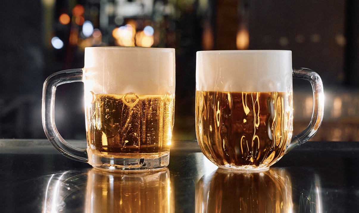 Two different mugs of lager beer make for the Ambiente food and beverage group.