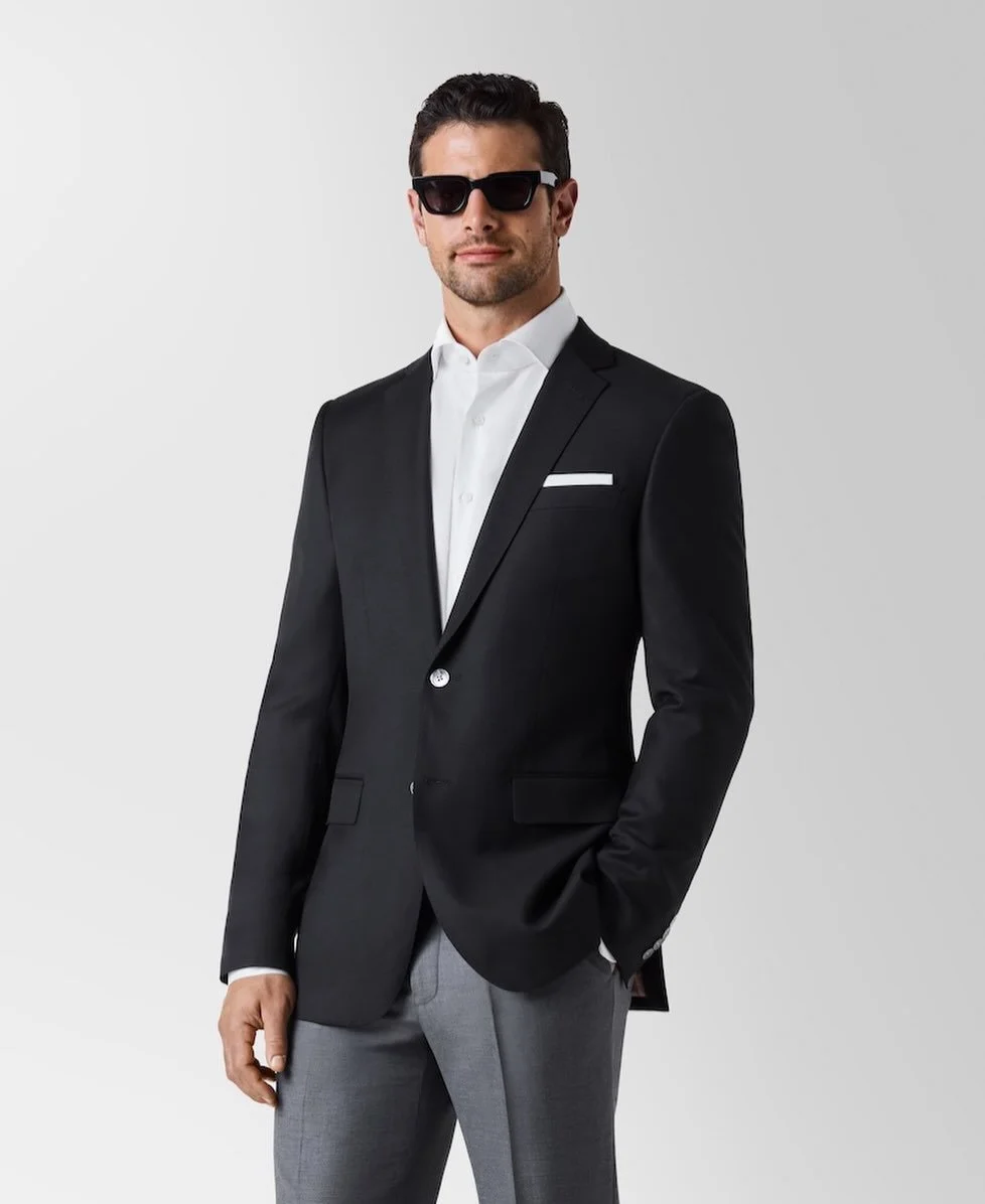 A wardrobe essential, refined.⁠
⁠
Our Black Blazer from the Stock Program is shown here in our smooth fabric option, offering a clean, modern finish that transitions effortlessly from business to evening wear. Available in a range of classic colors a