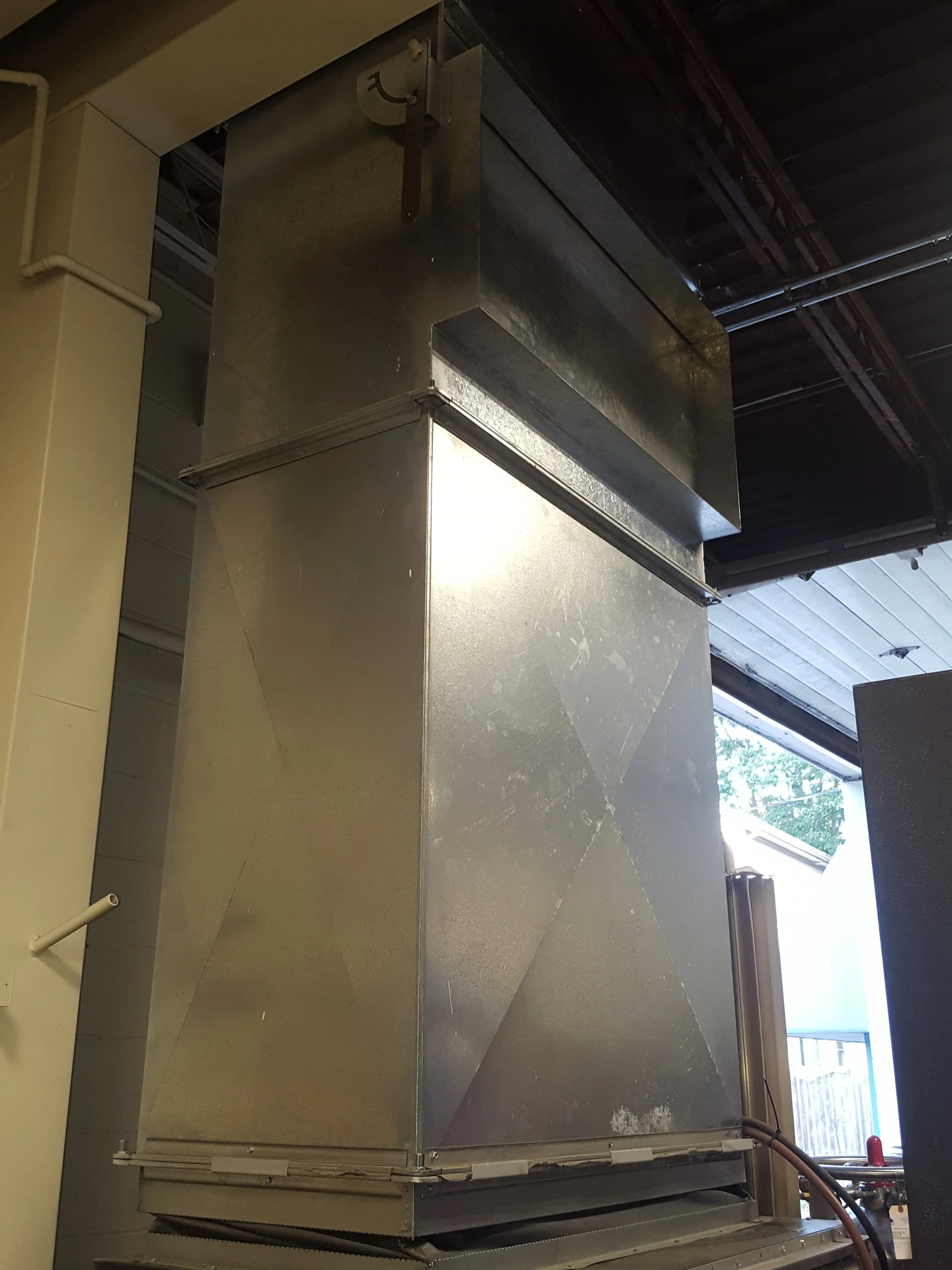 Custom exhaust duct work to carry chiller system heat out of the building in the summer and inside in the winter.