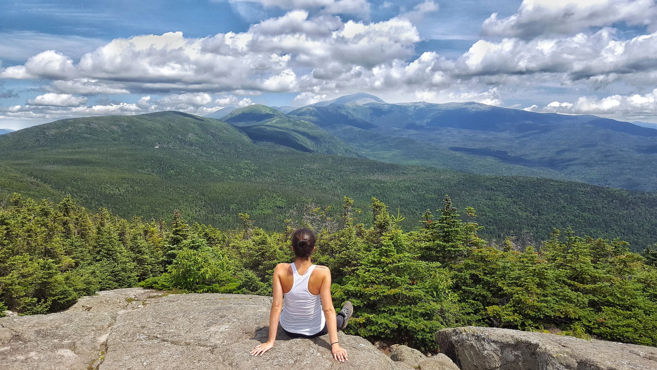 girl sitting on mount jackson looking out to mountain views