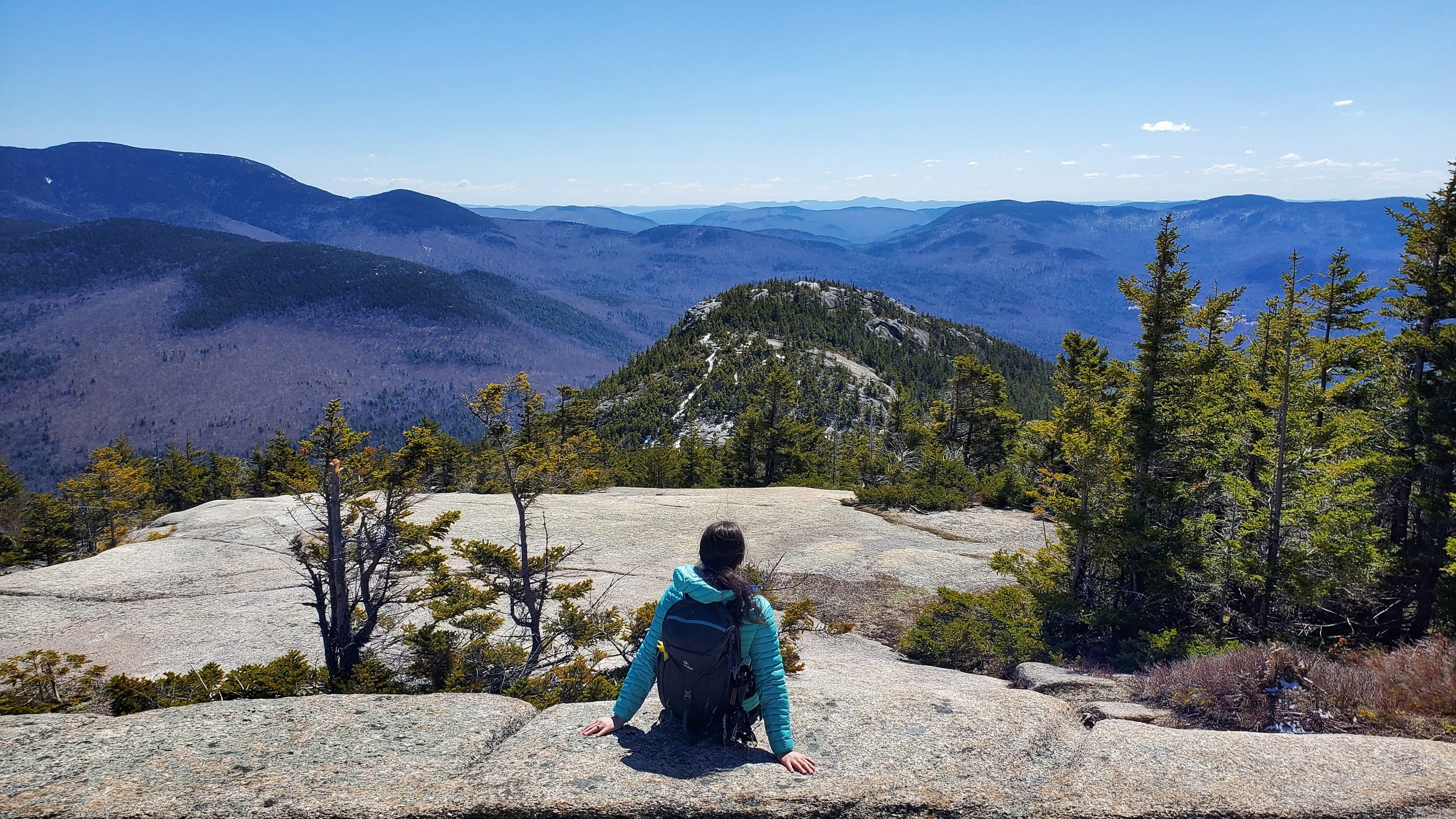 girl sitting on the welch-dickey loop looking out to mountains