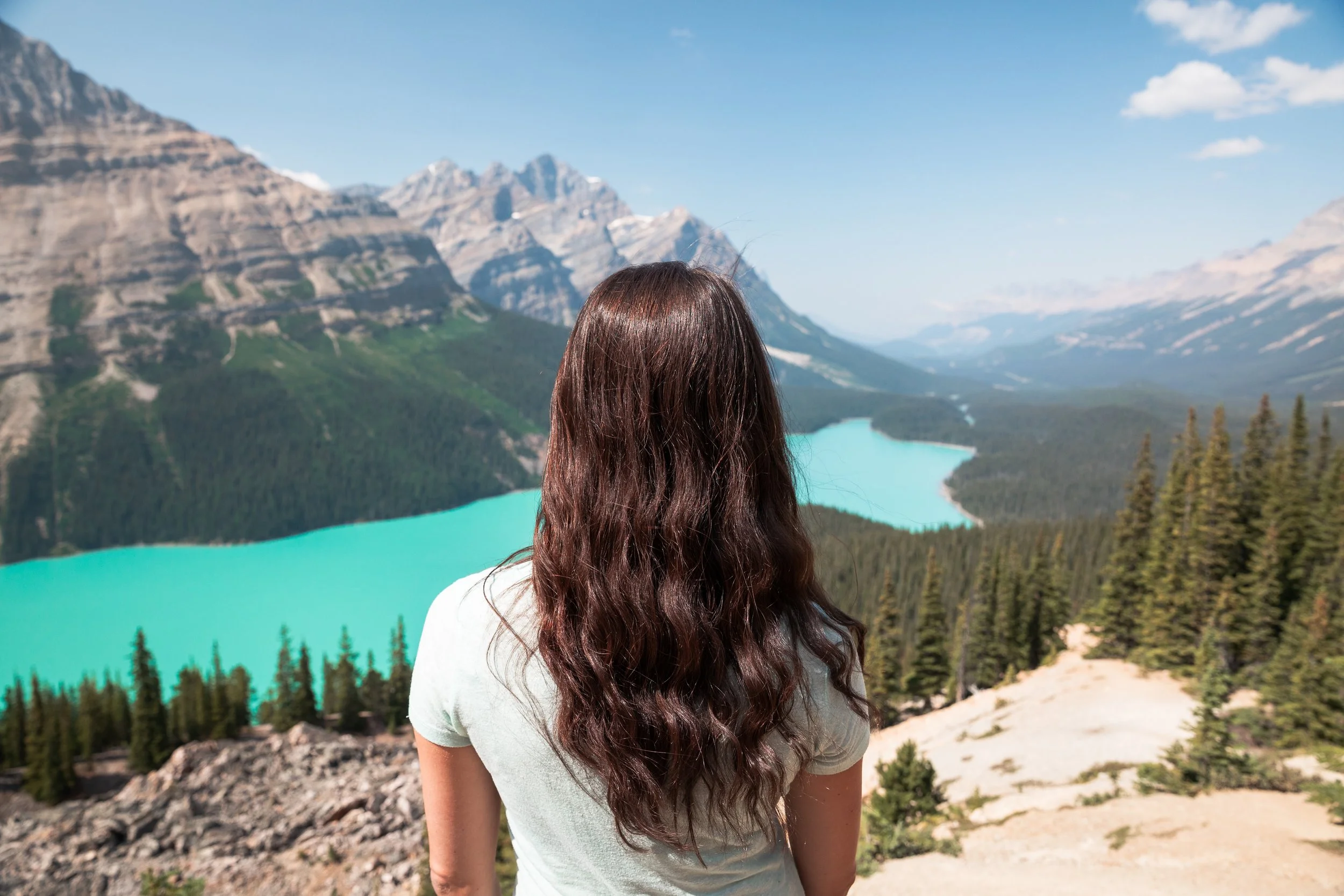 standing at viewpoint overlooking peyto lake in banff