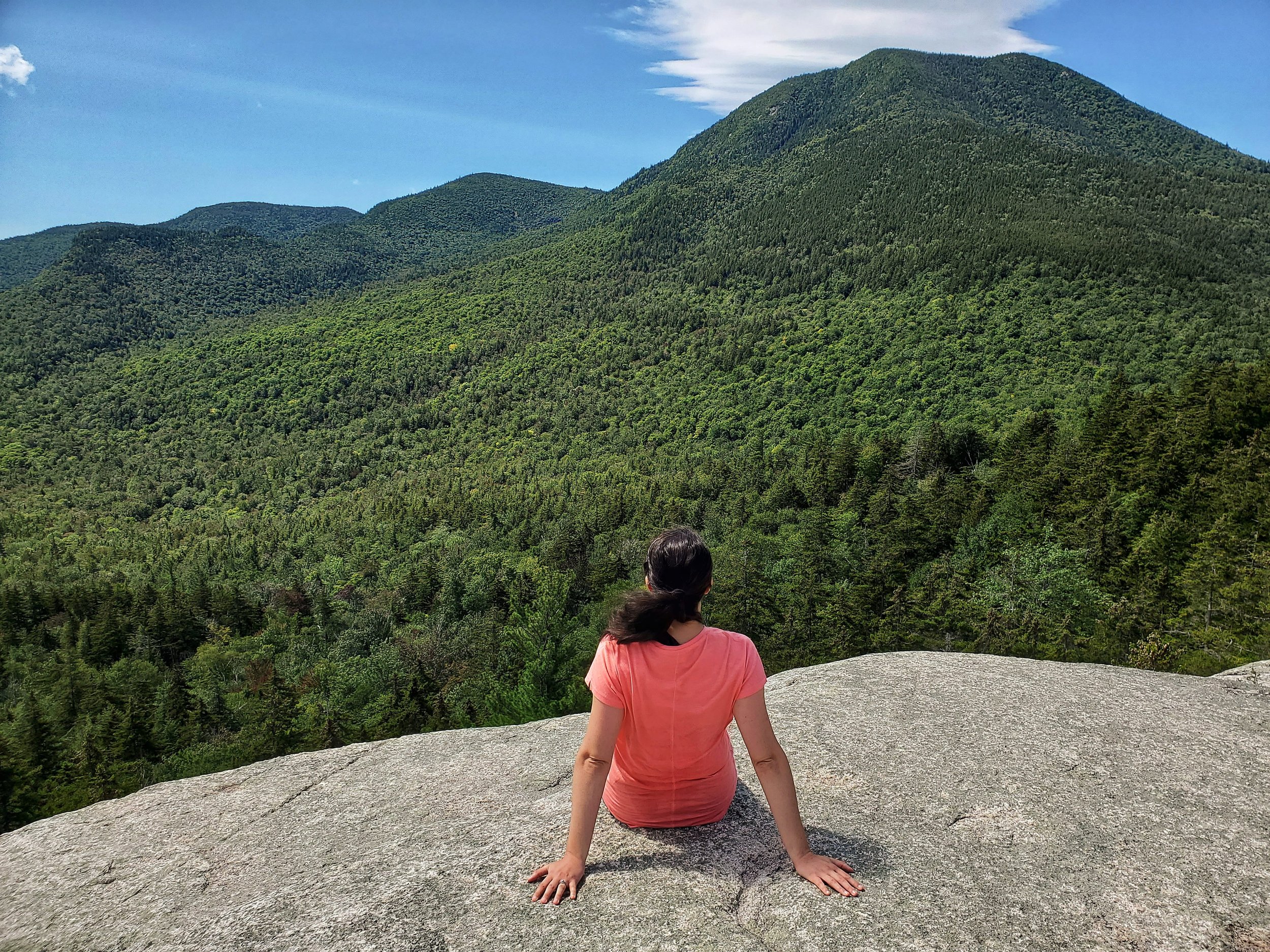 girl sitting on hedgehog mountain in the white mountains