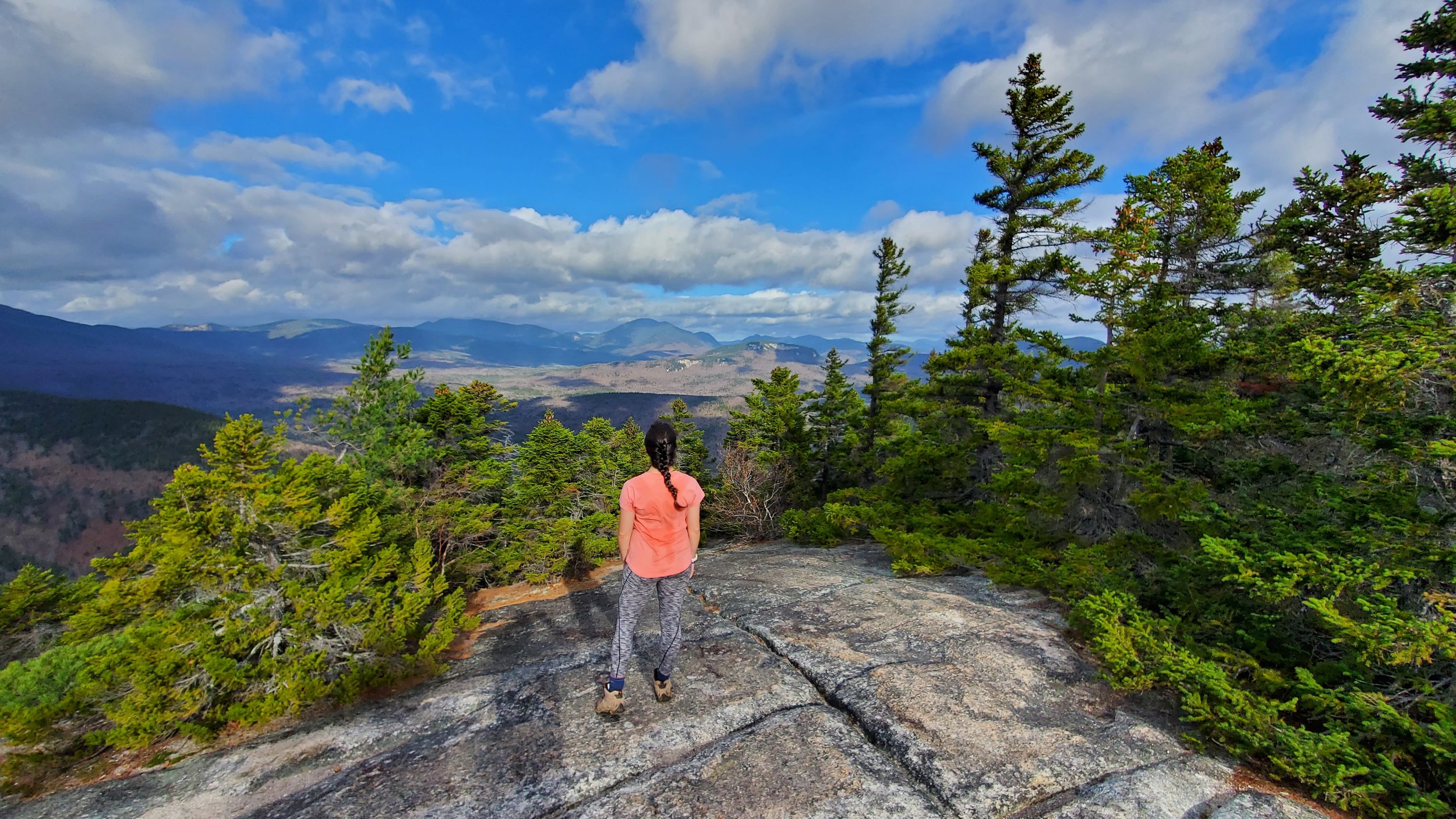 girl standing on potash mountain looking out to views