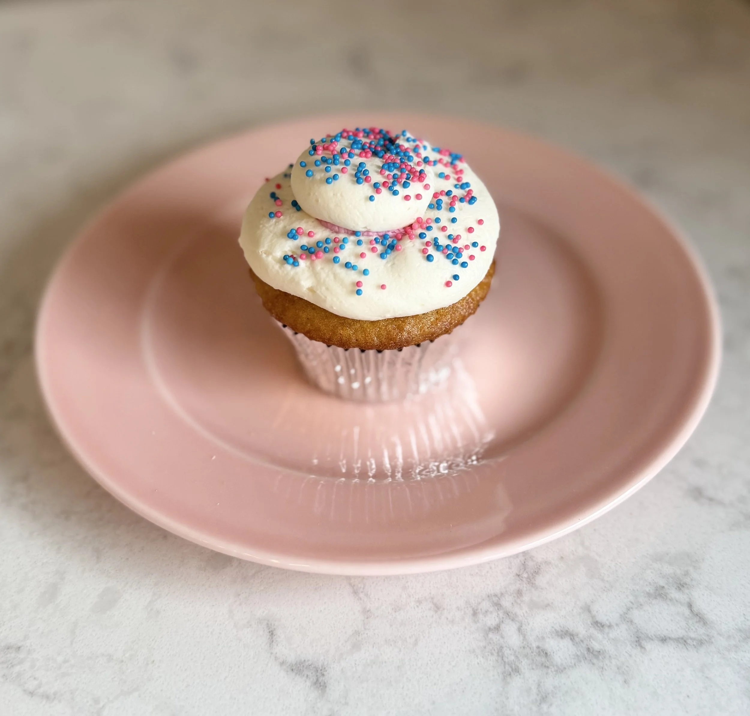 Gender Reveal Cupcake on pink plate.jpg