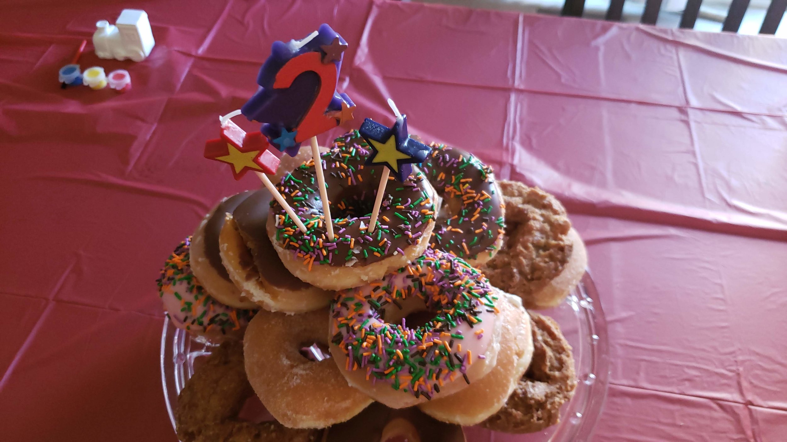 Instead of getting an expensive cake, we always opt for doughnuts, which are way cheaper and give your guests some choices.