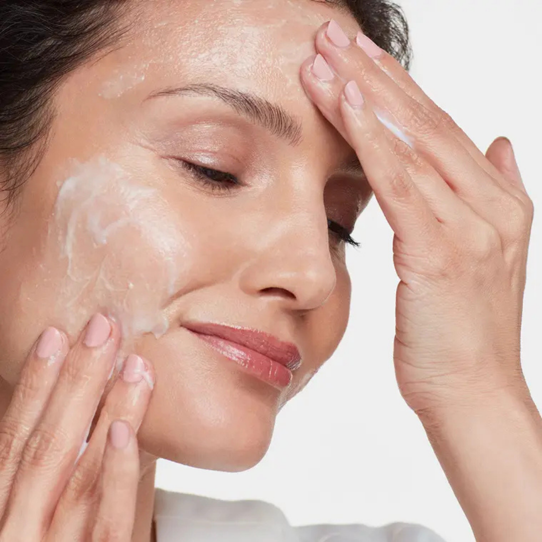 HydroPeptide Exfoliating Cleanser applied to the face to exfoliate, smooth and brighten dull skin