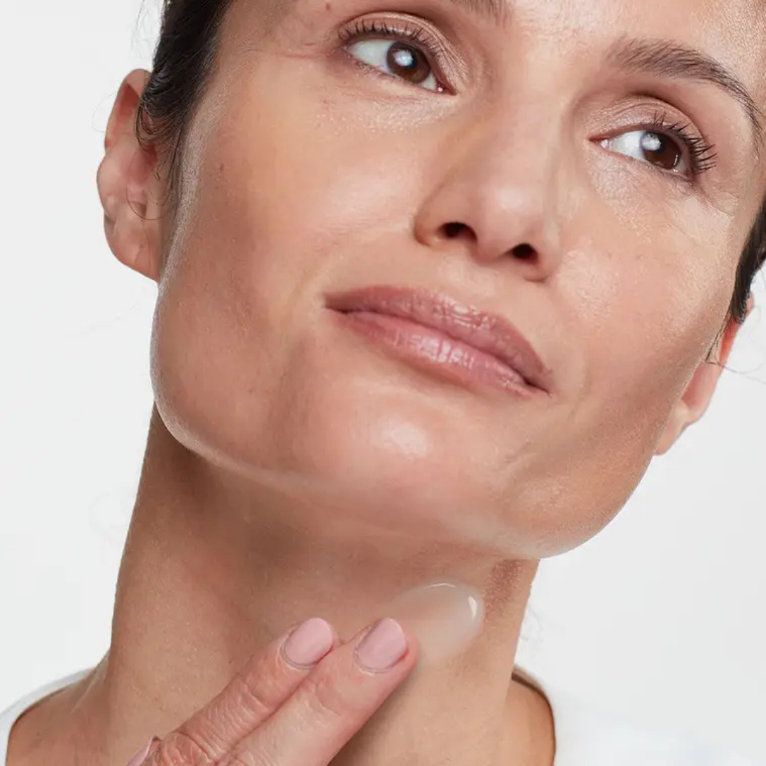 HydroPeptide Firma-Fix Nectar firming serum applied to the neck for smoother, firmer-looking skin