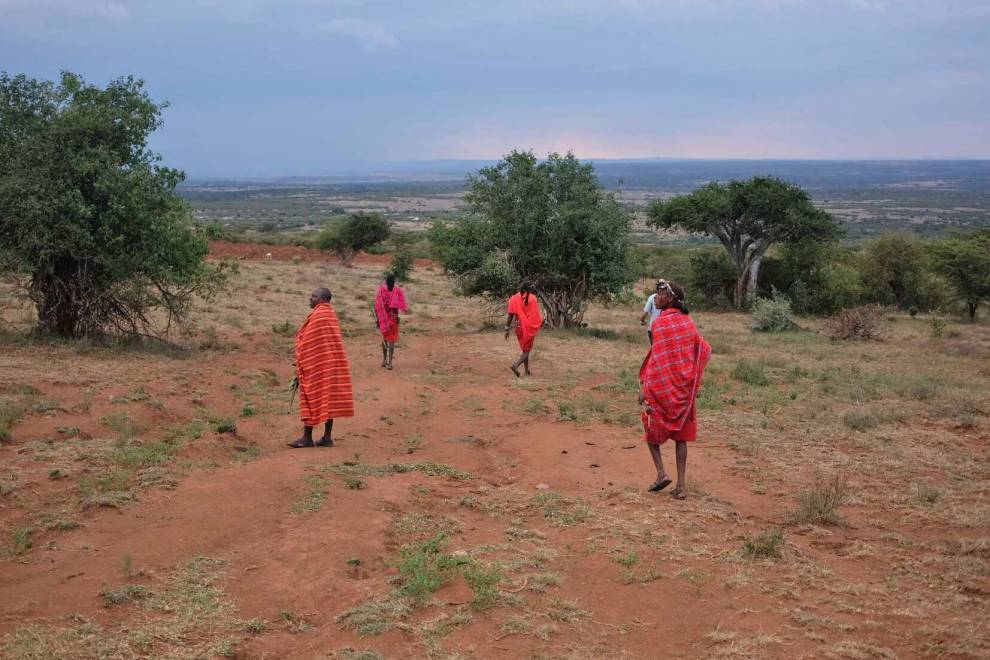 Maasai warriors show the team some of the indigenous plants they hope to monitor and protect. © Megan Laws