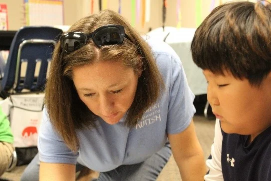 Mrs. Elisabeth Newell with special needs student, Seongmin Choi