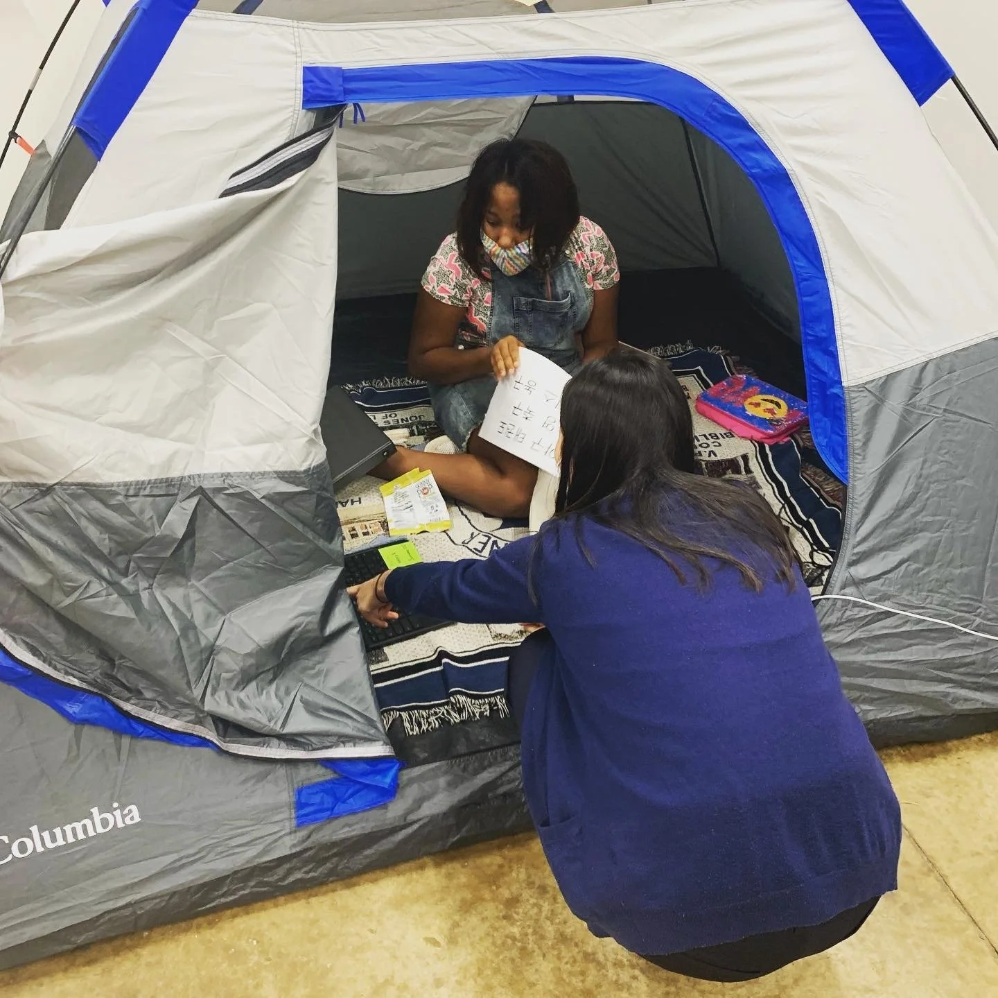 Taylor and Juyeon learning center tent.JPG