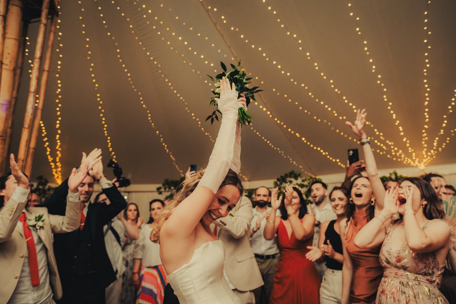 Summer wedding in Provence under the tent full with lights.