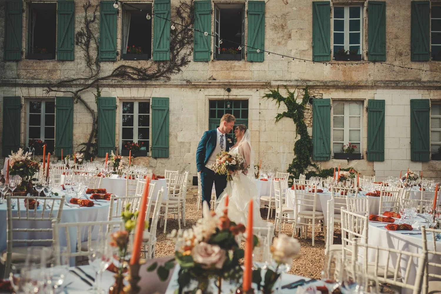 couple portrait dinner area manoir de longeveau backdrop