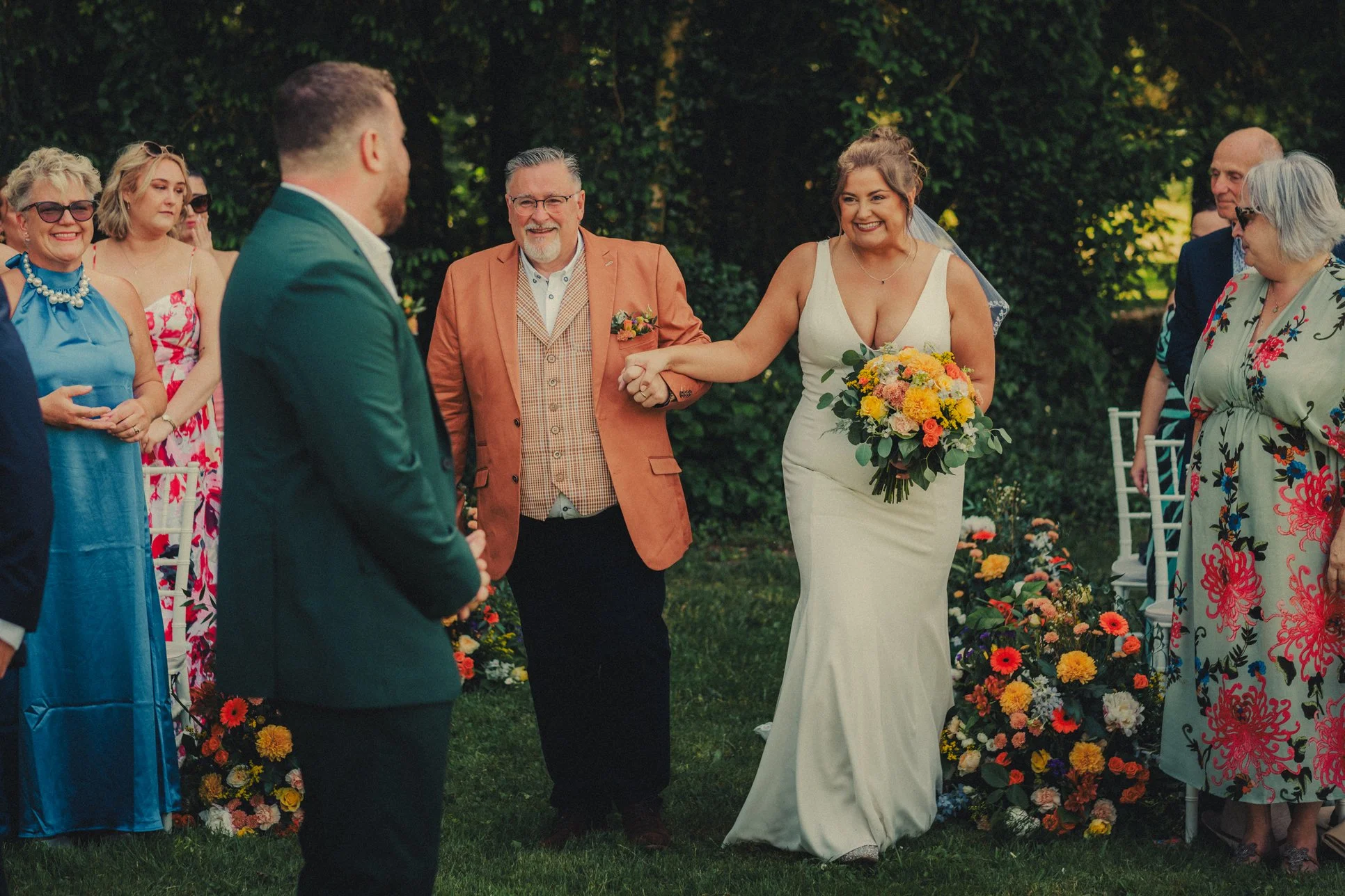 Bride walking down the aisle during Dordogne château wedding ceremony