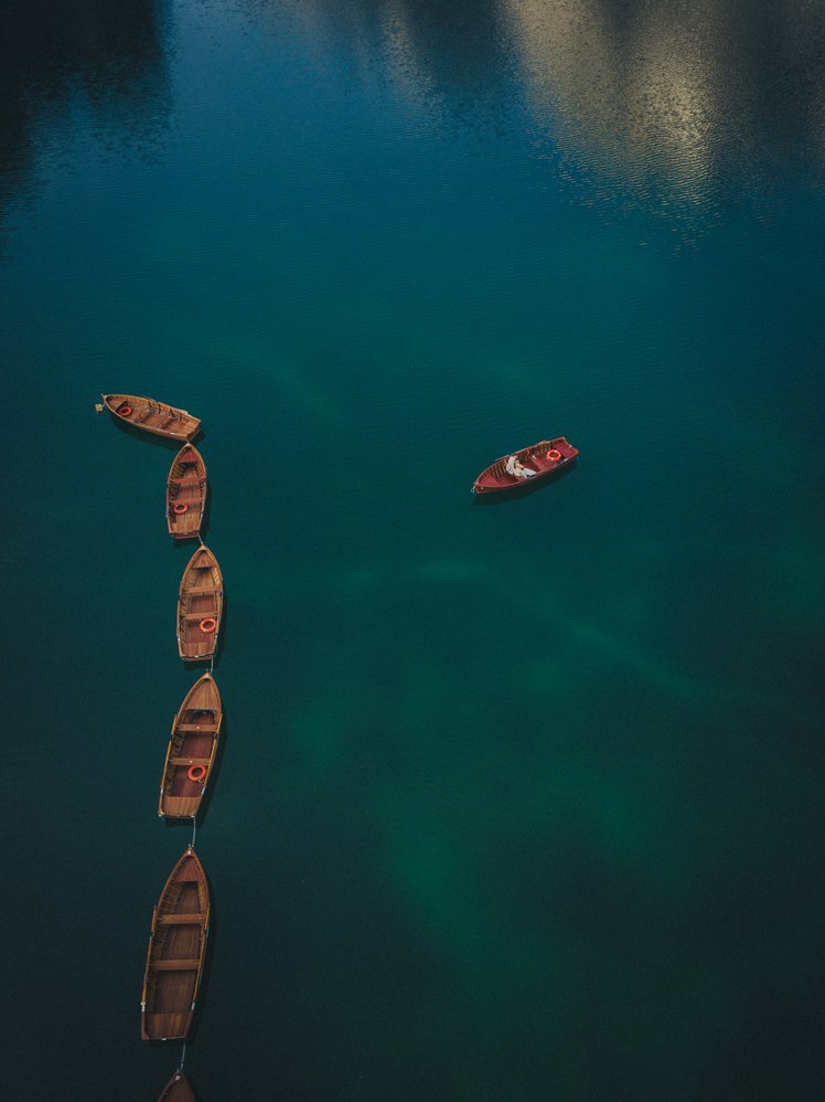 drone shot from above at lago di braies dolomites italy