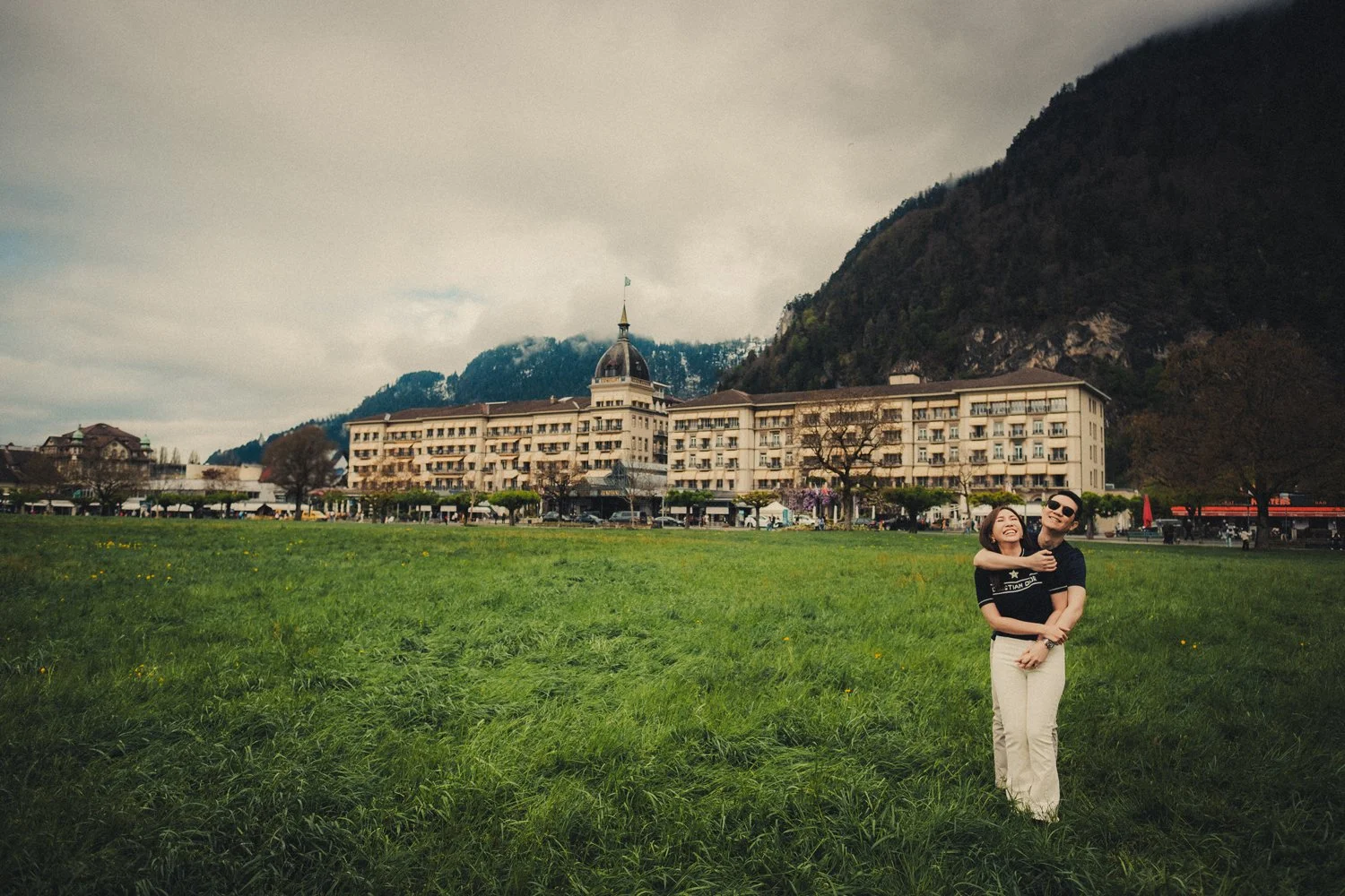 Couple exploring Interlaken together on a spring morning in Switzerland.