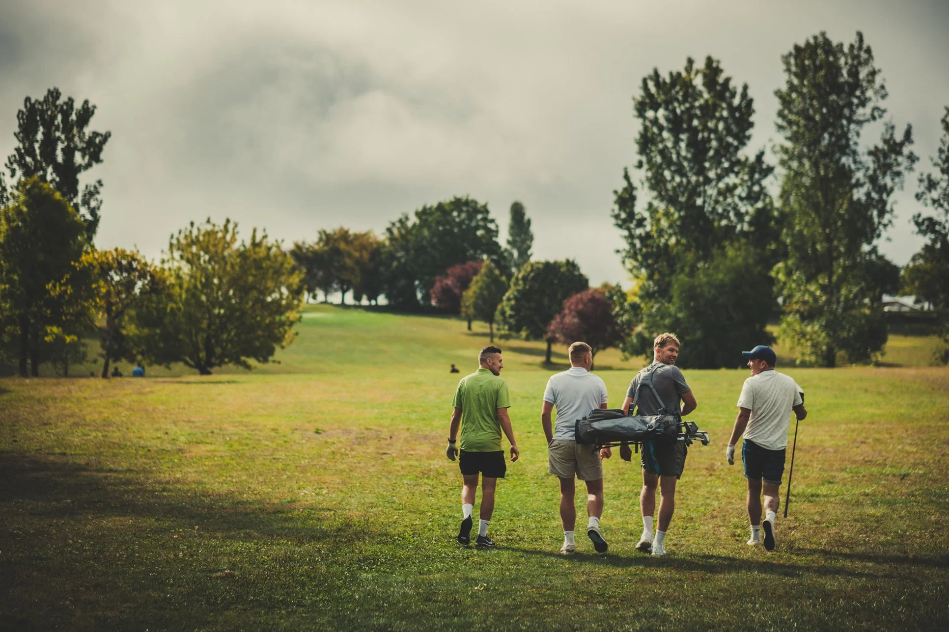 groom and friends playing golf before the wedding ceremony at manoir de longeveau