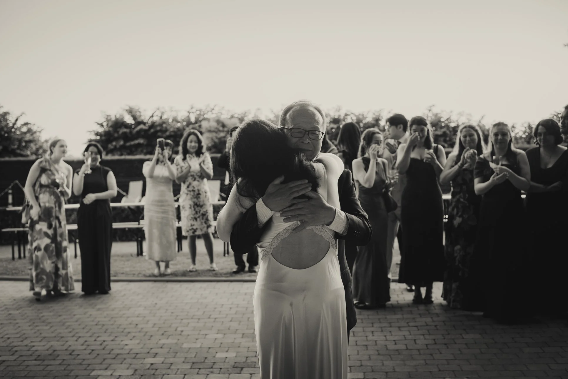 Bride having an emotional wedding first dance with her father at Chateau du Doux.