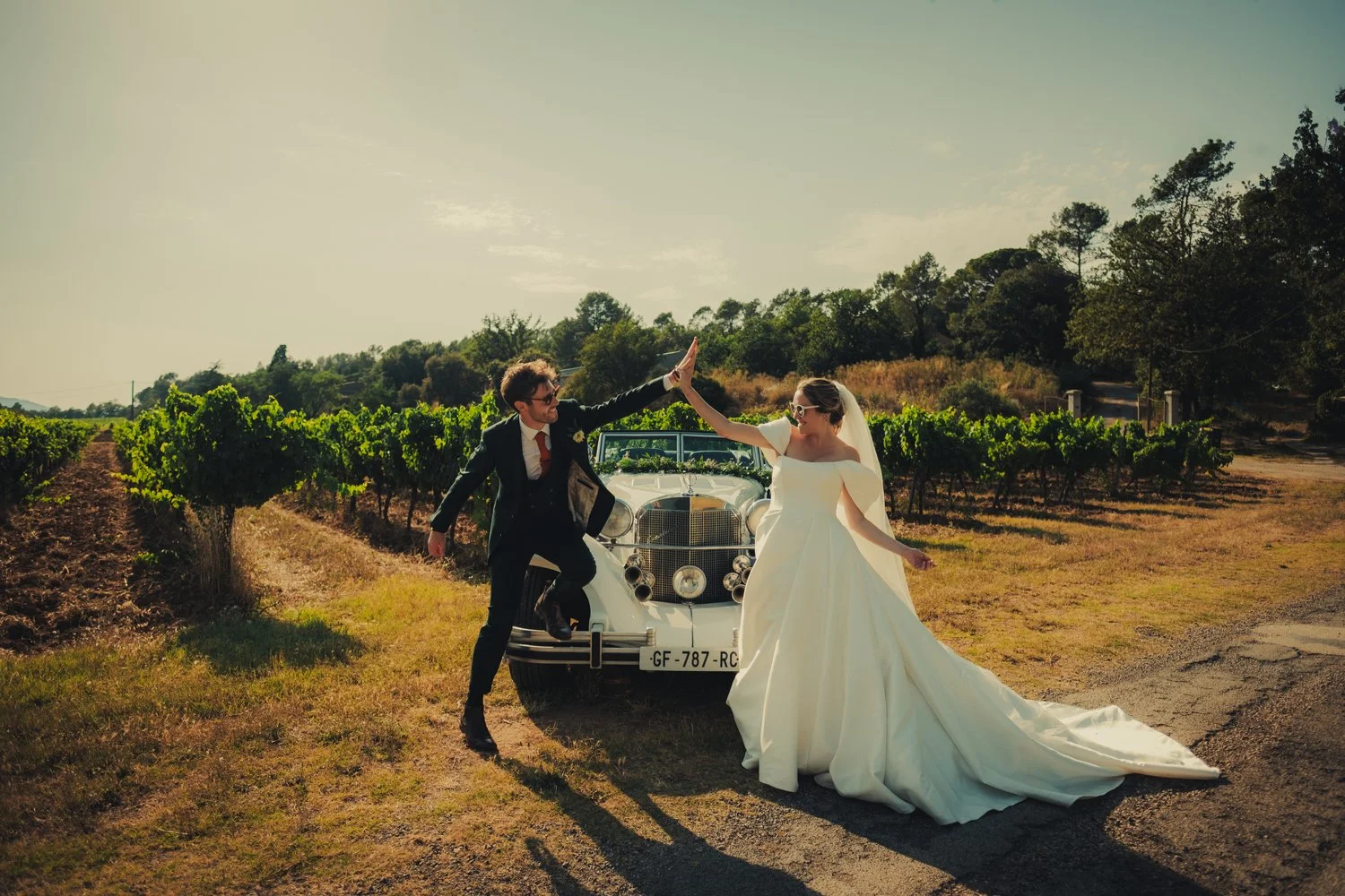 Bride and groom having a fun couple session at their wedding in Provence.