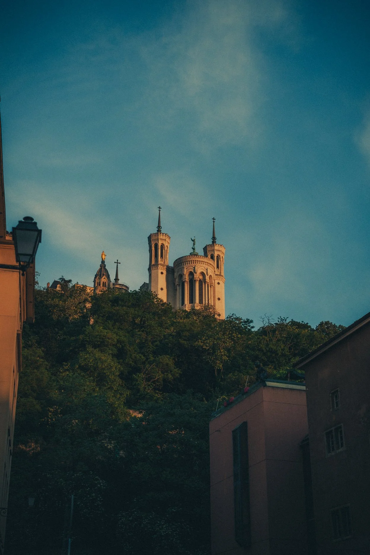 Golden sunrise shining on Basilica of Notre Dame of Fourvière, Lyon, France.