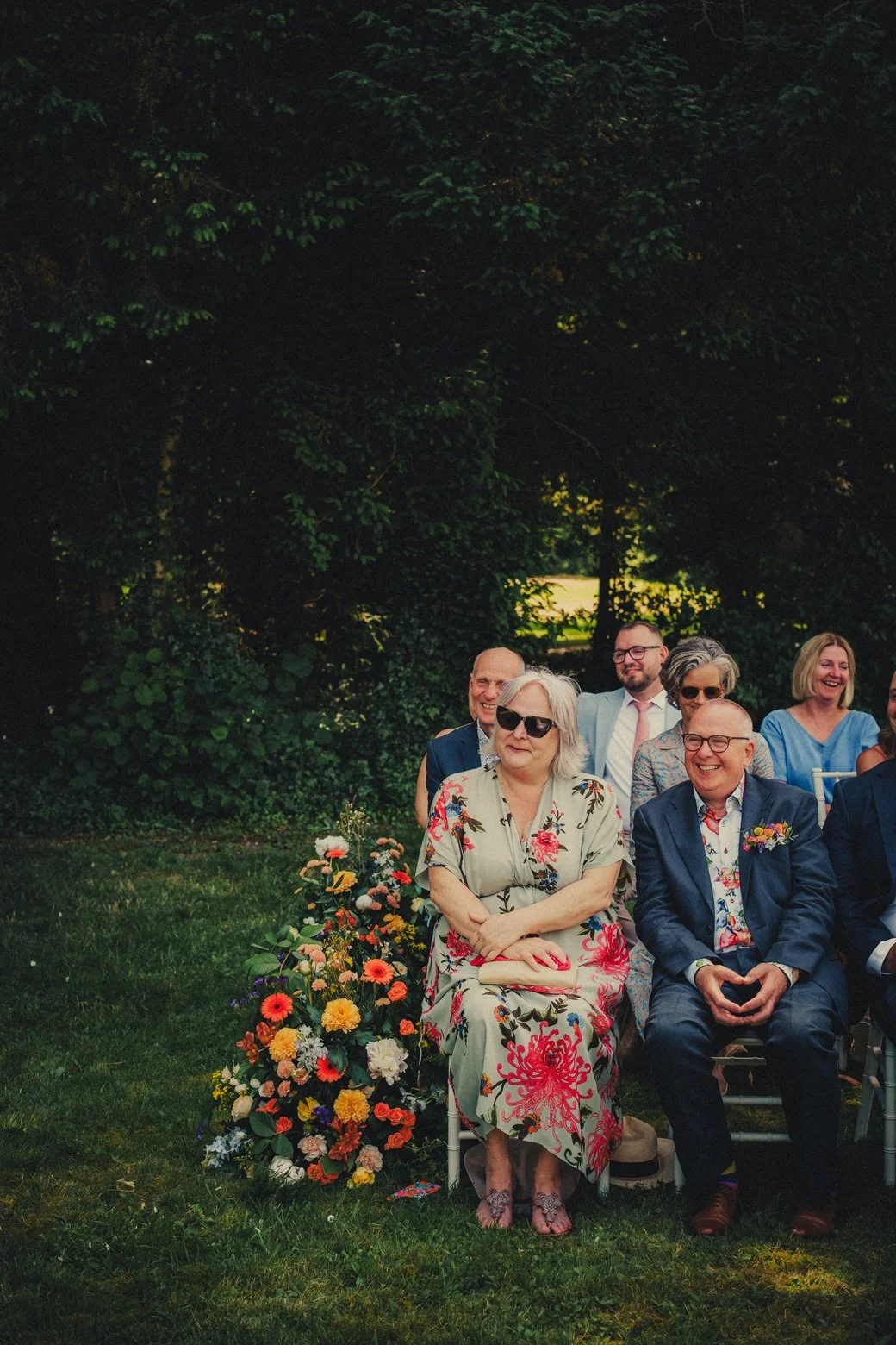 Guests laughing during heartfelt wedding ceremony