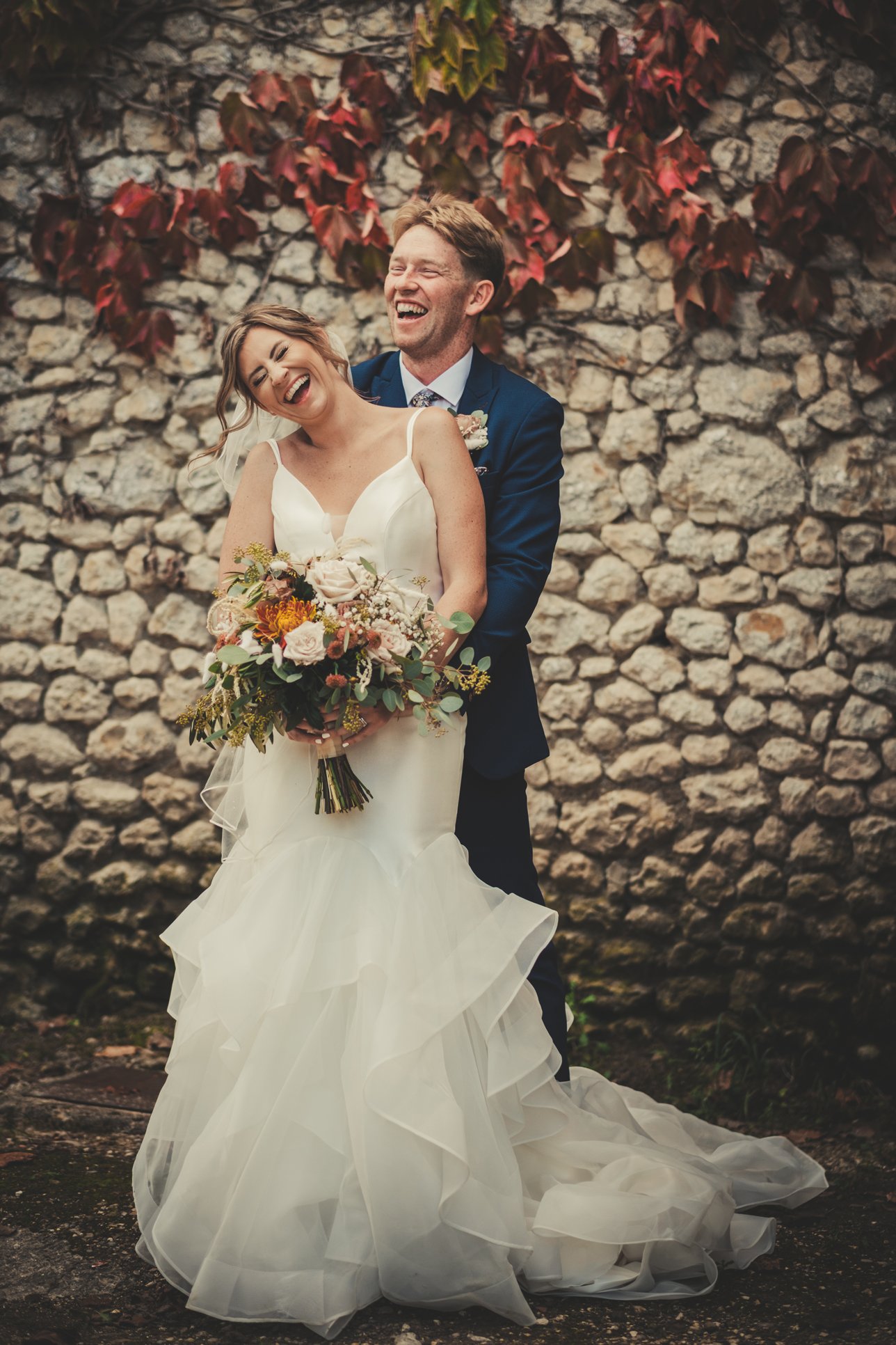 couple laughing candid wedding moment