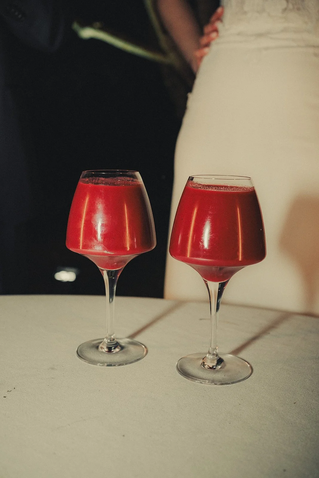 berries wedding cake sauce in wine glasses.
