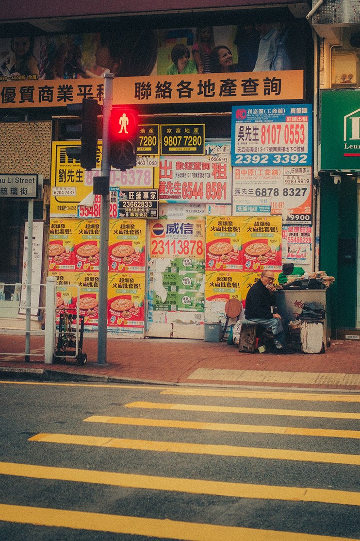Hong Kong street with lights and colorful buildings.