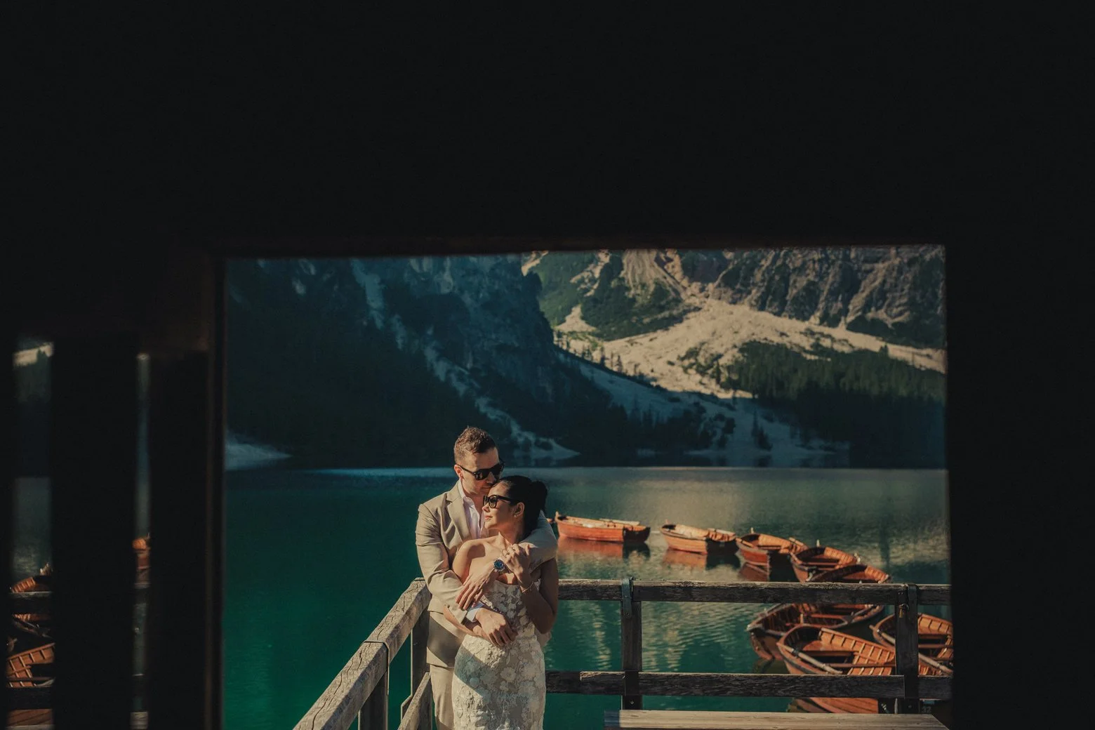 Lago di Braies elopement photographer capturing couple inside the boathouse