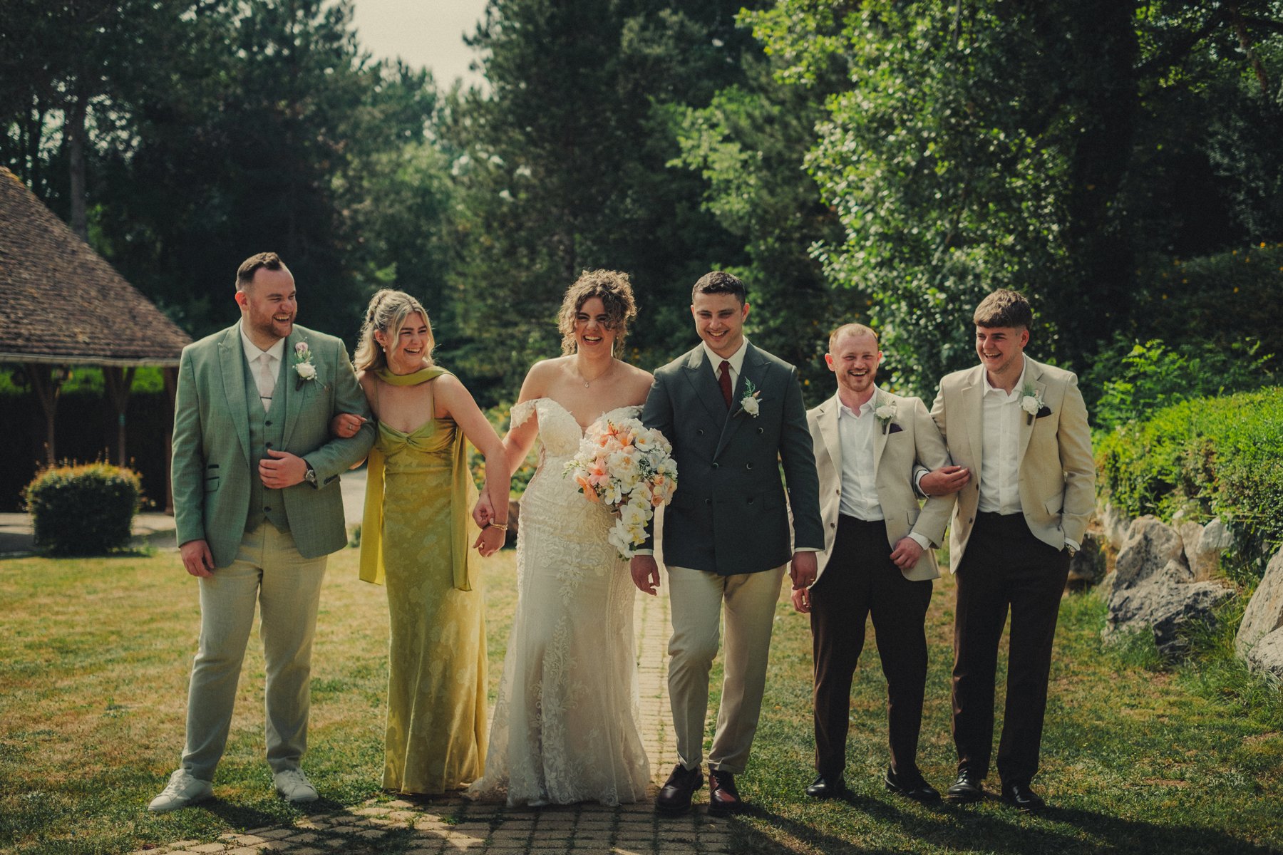 Bride and groom having a group photo with their best friends at Chateau du Raysse.