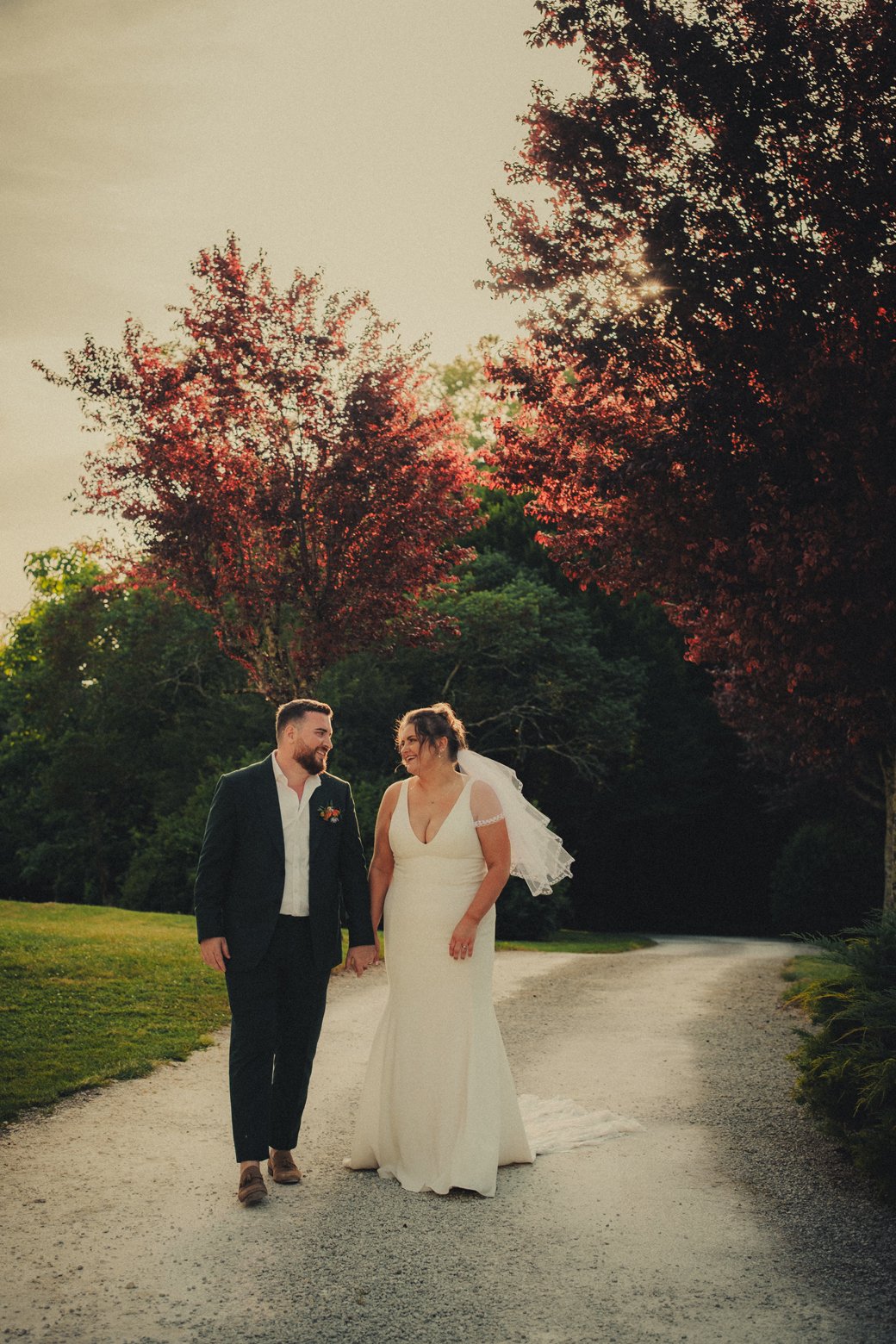 Couple walking during golden hour in Dordogne countryside