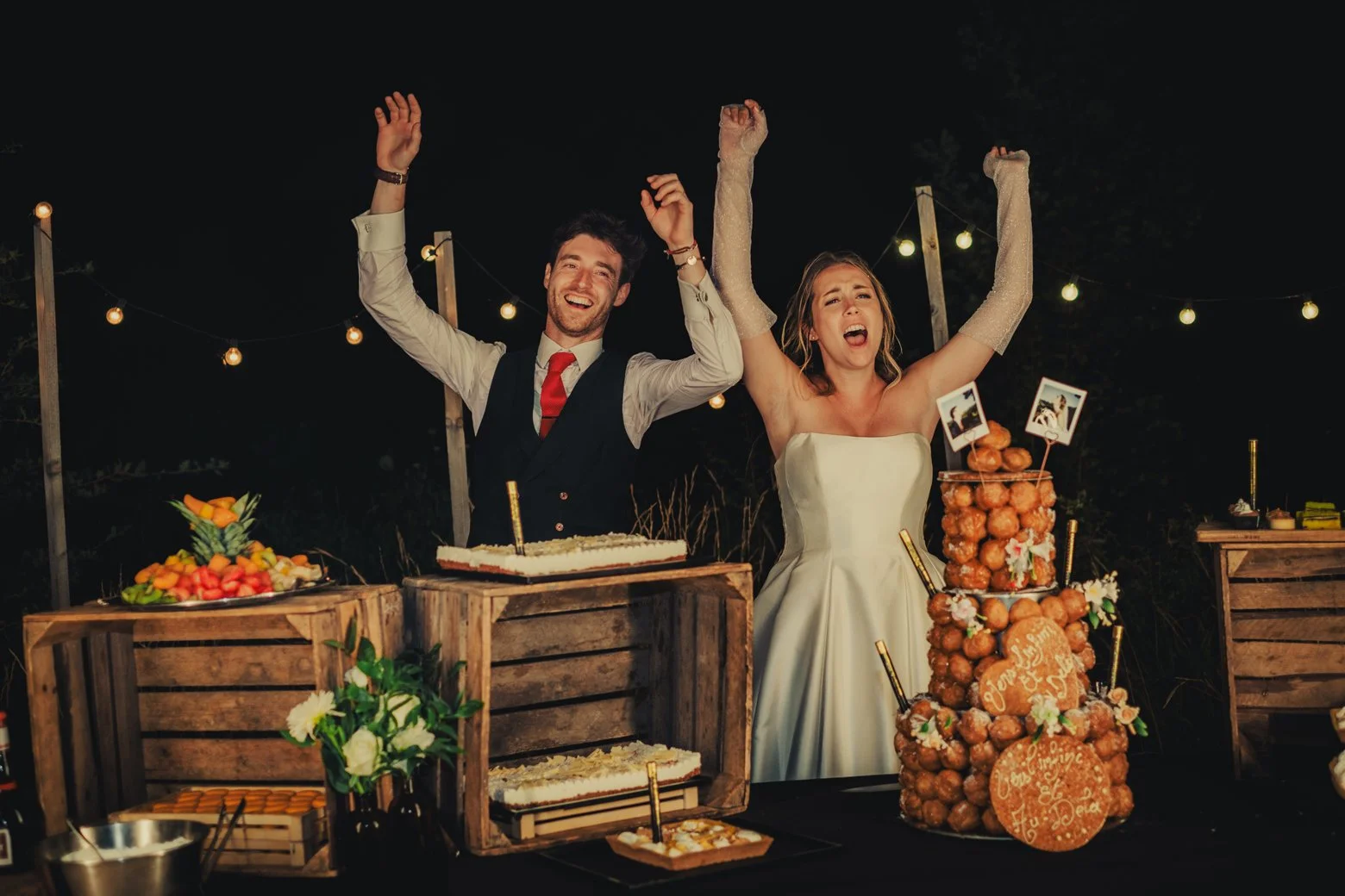 Bride and groom celebrating moment with cakes and desserts during their wedding in Provence.