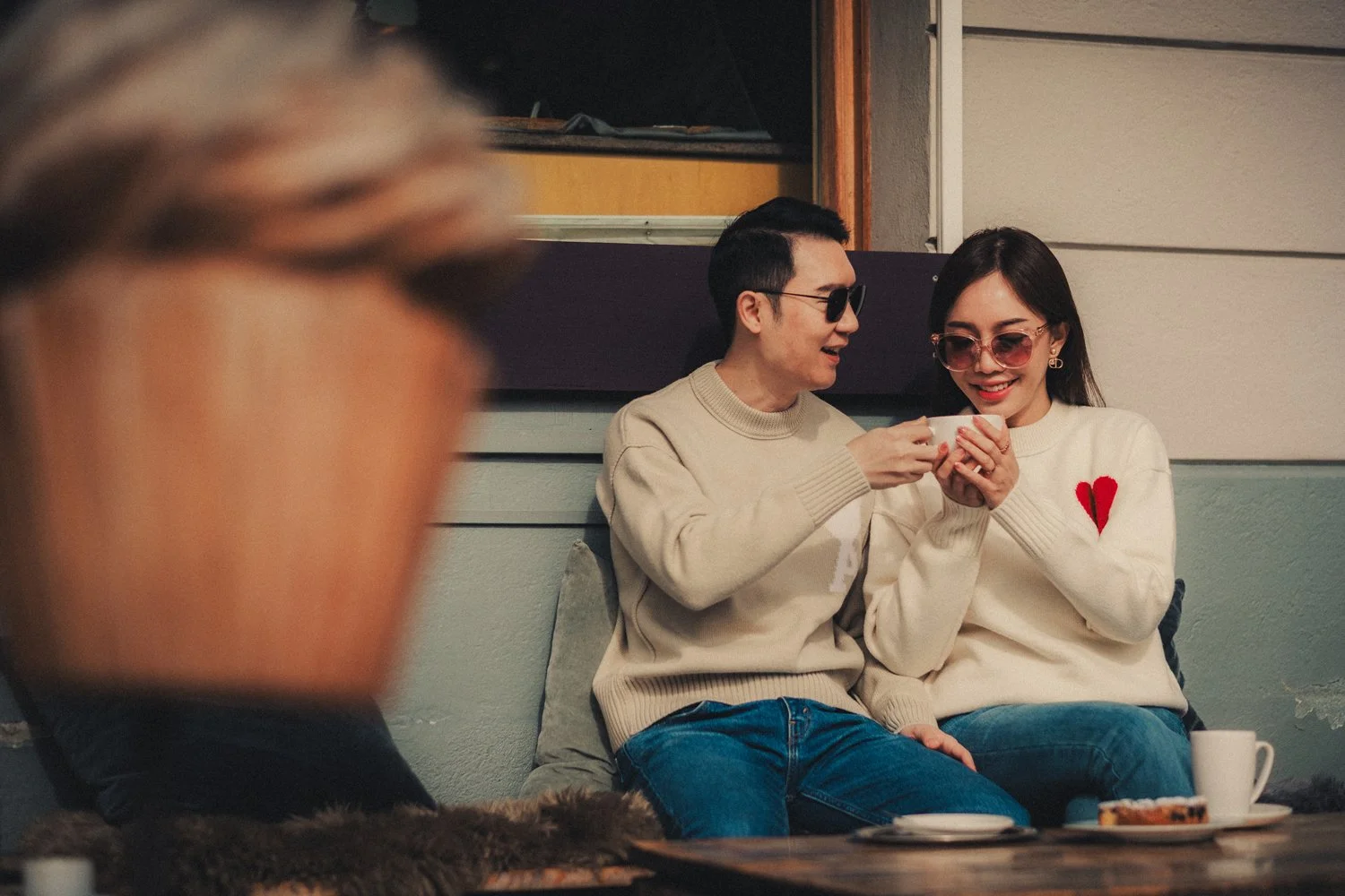 Candid moment of a couple enjoying coffee together in Interlaken, Switzerland.