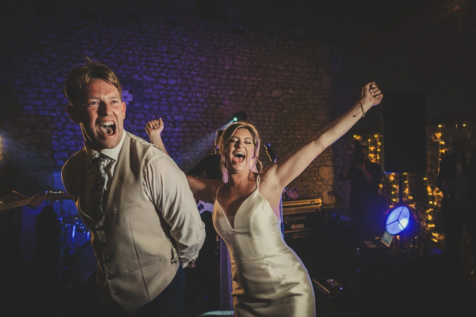 bride and groom singing dancing live band