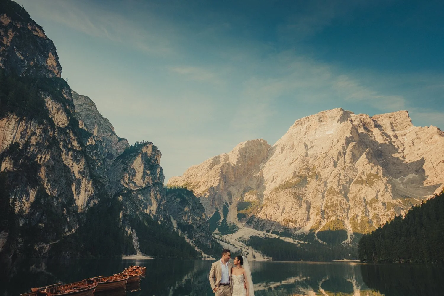 Italy elopement videographer filming a couple in Lago di Braies.